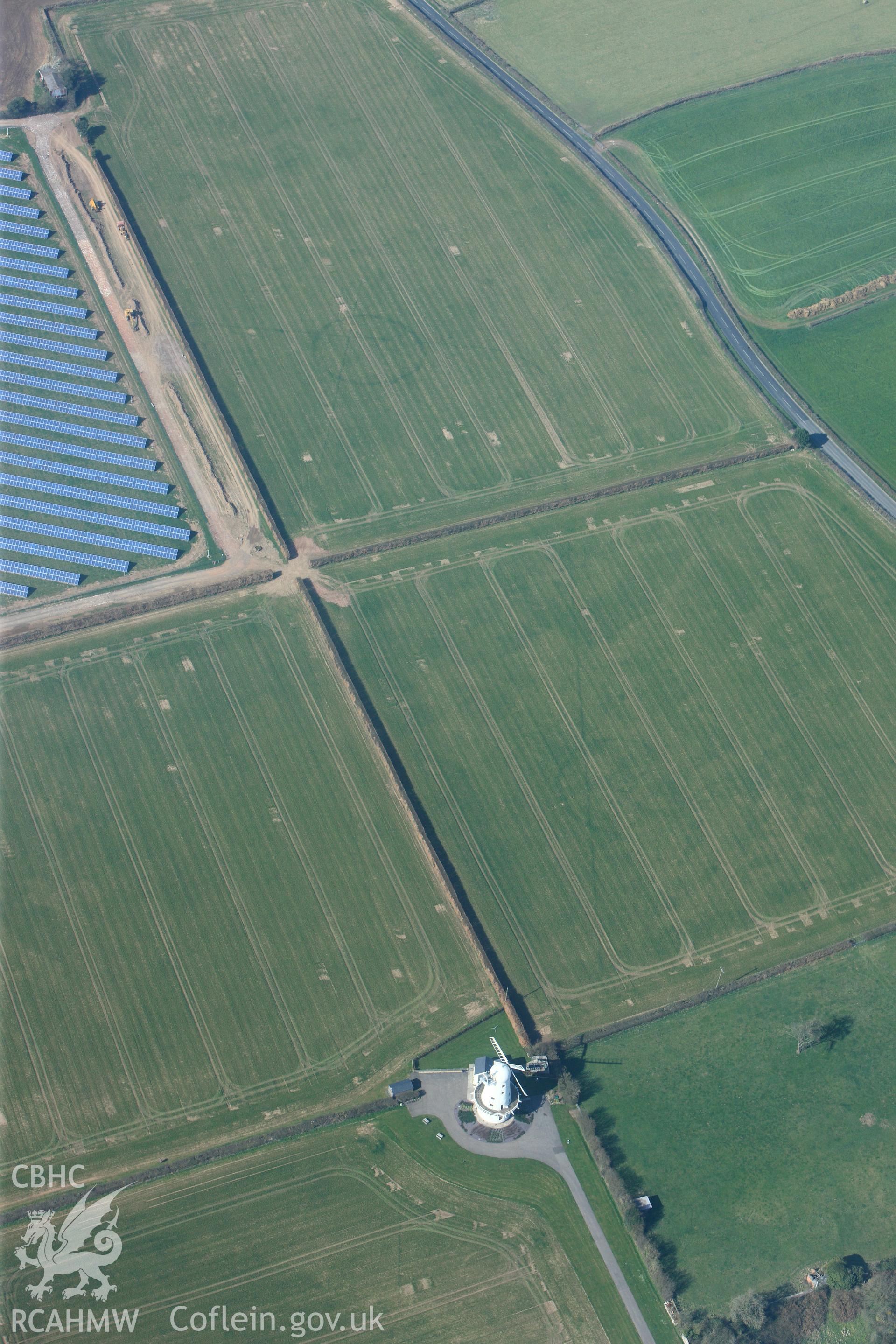 RCAHMW colour oblique photograph of Llancayo Farm Roman marching camp, showing east side of camp and barrow cemetery. Taken by Toby Driver and Oliver Davies on 28/03/2012.
