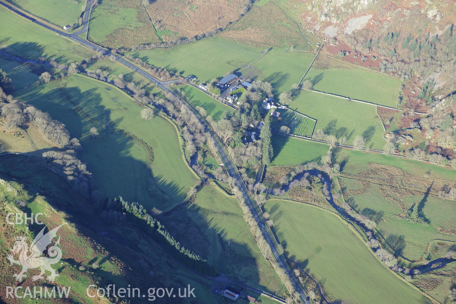 RCAHMW colour oblique photograph of Dolbenmaen Castle Mound, and village. Taken by Toby Driver on 10/12/2012.