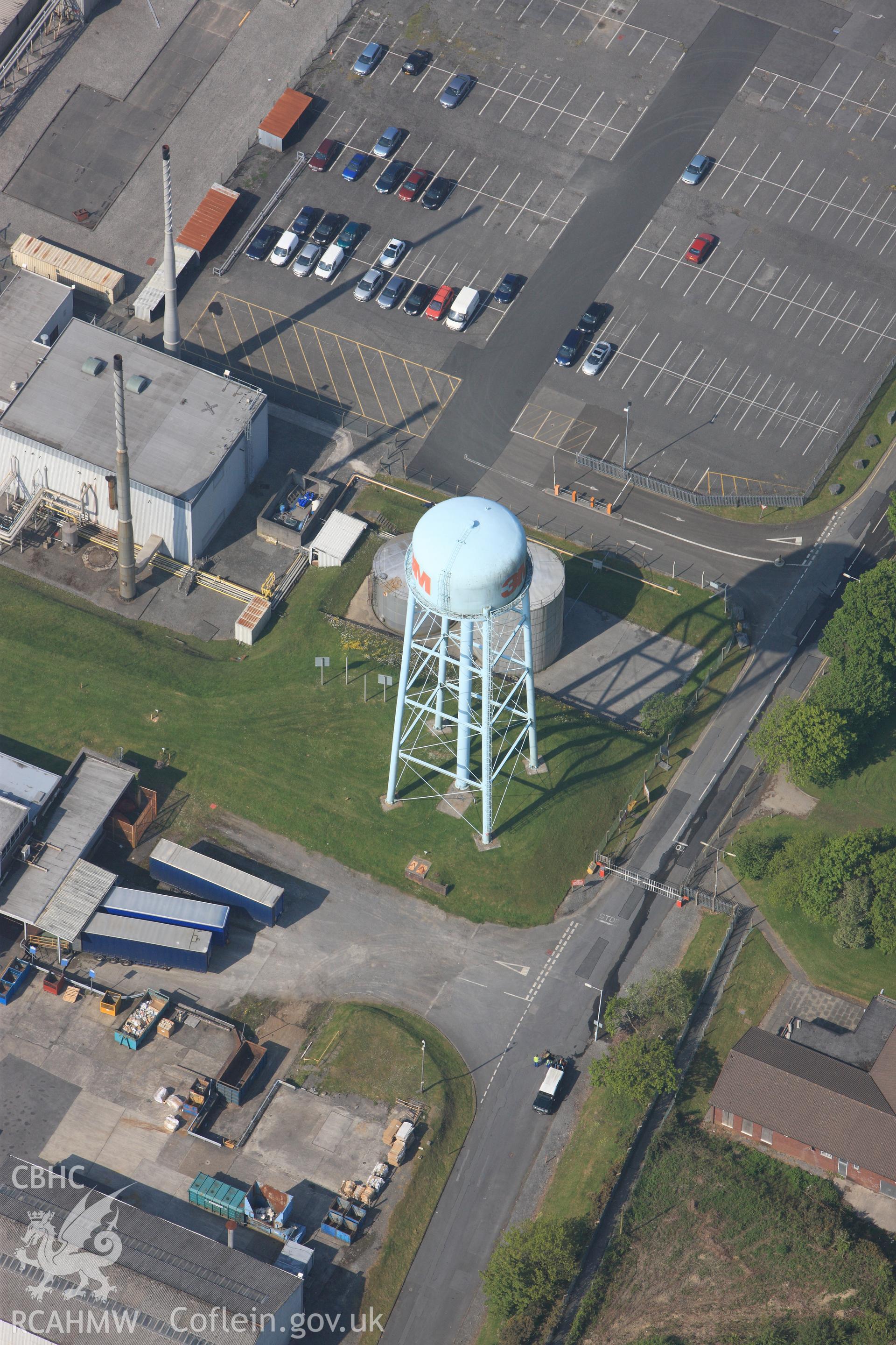 RCAHMW colour oblique photograph of Close view of 3M factory water tower, looking south west. Taken by Toby Driver on 24/05/2012.