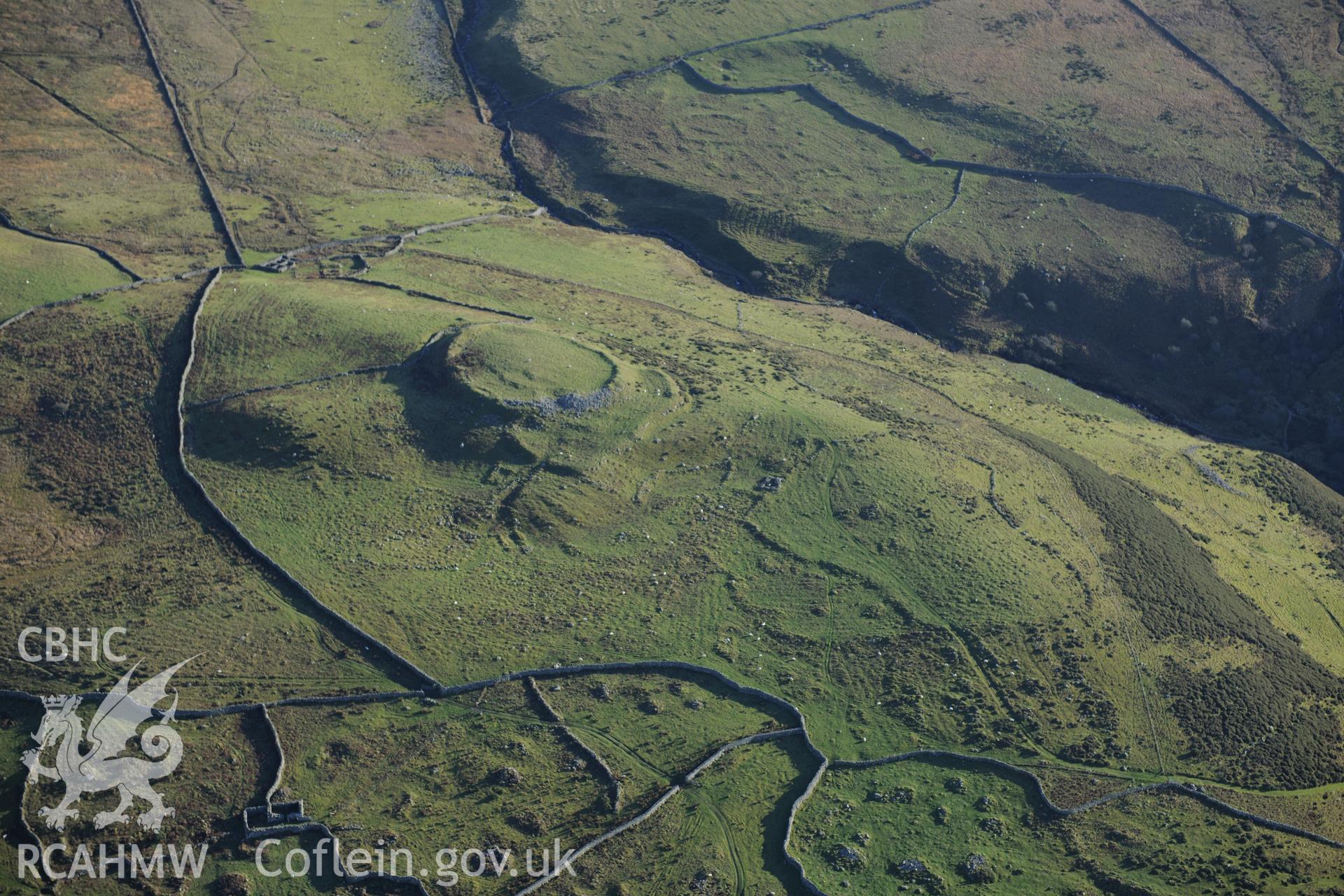 RCAHMW colour oblique photograph of Pen y Dinas, hillfort and upland landscape. Taken by Toby Driver on 10/12/2012.