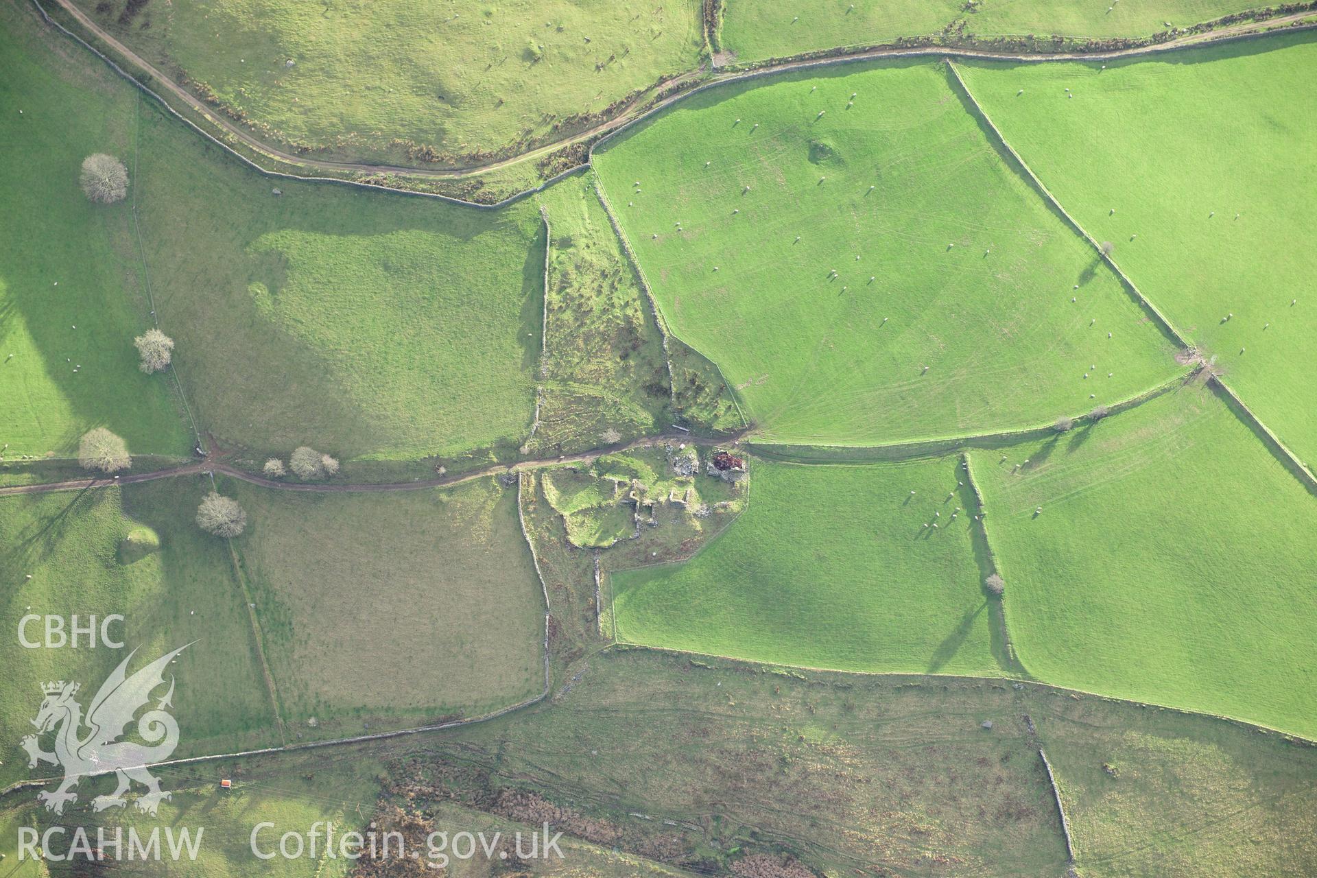 RCAHMW colour oblique photograph of Castellcadarn enclosure, farmstead. Taken by Toby Driver on 28/11/2012.