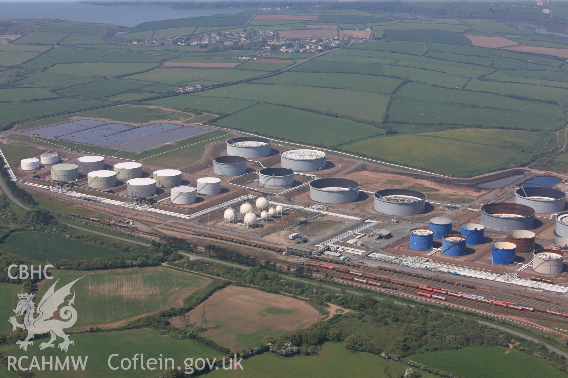 RCAHMW colour oblique photograph of General view of southern end of Amoco oil refinery, looking west. Taken by Toby Driver on 24/05/2012.