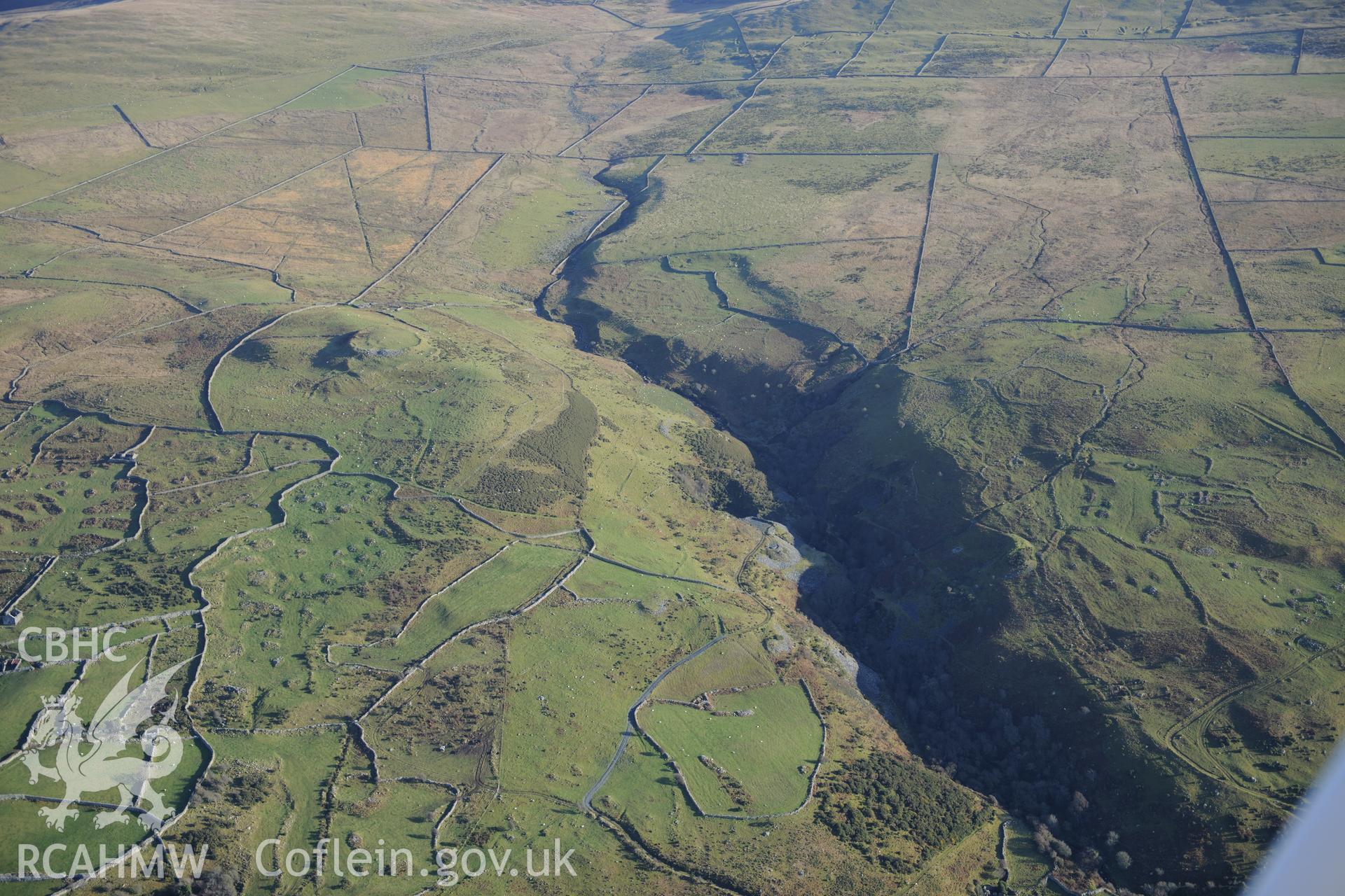 RCAHMW colour oblique photograph of Pen y Dinas, hillfort and upland landscape. Taken by Toby Driver on 10/12/2012.