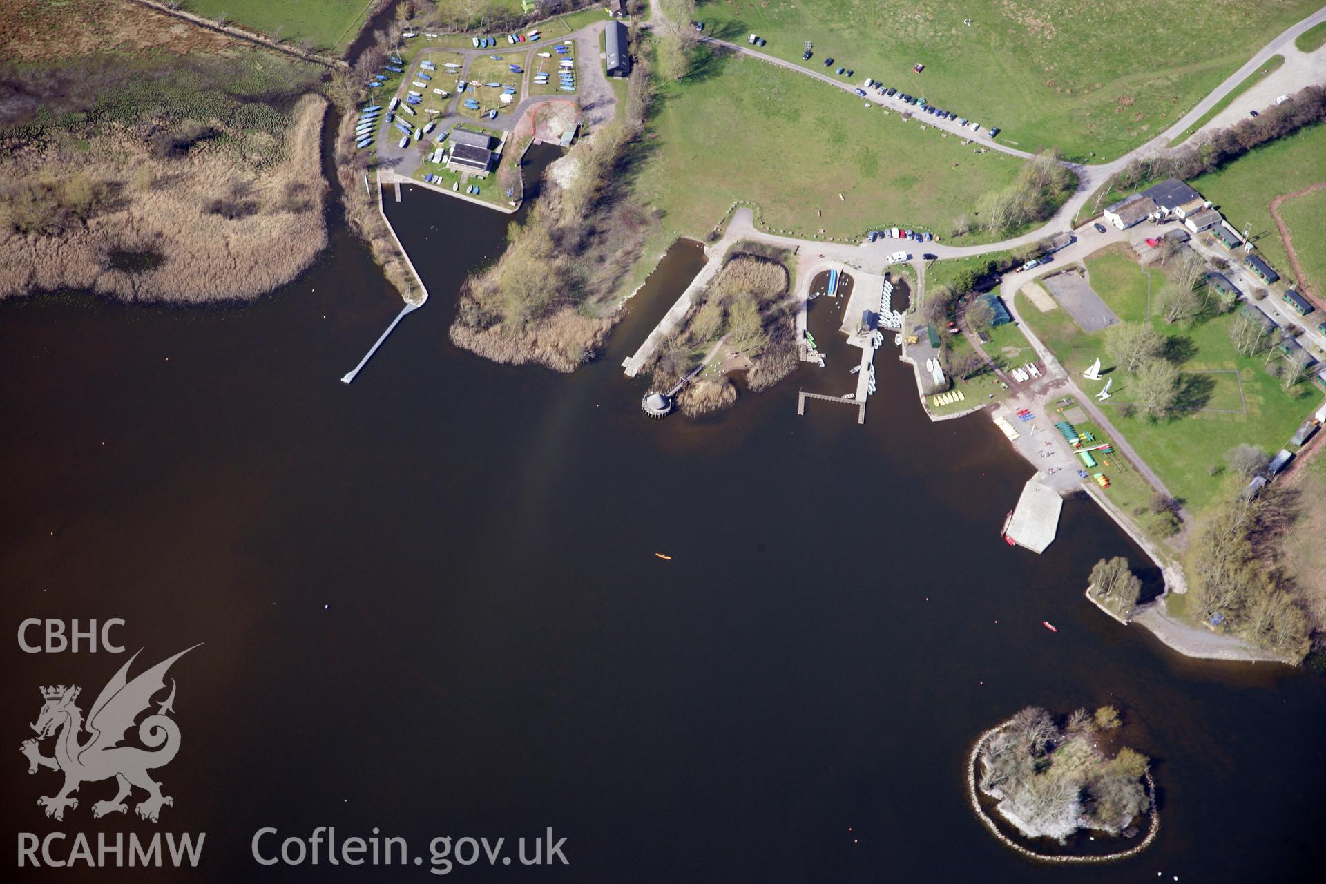 RCAHMW colour oblique photograph of The Welsh Crannog Centre, Llangorse. Taken by Toby Driver and Oliver Davies on 28/03/2012.