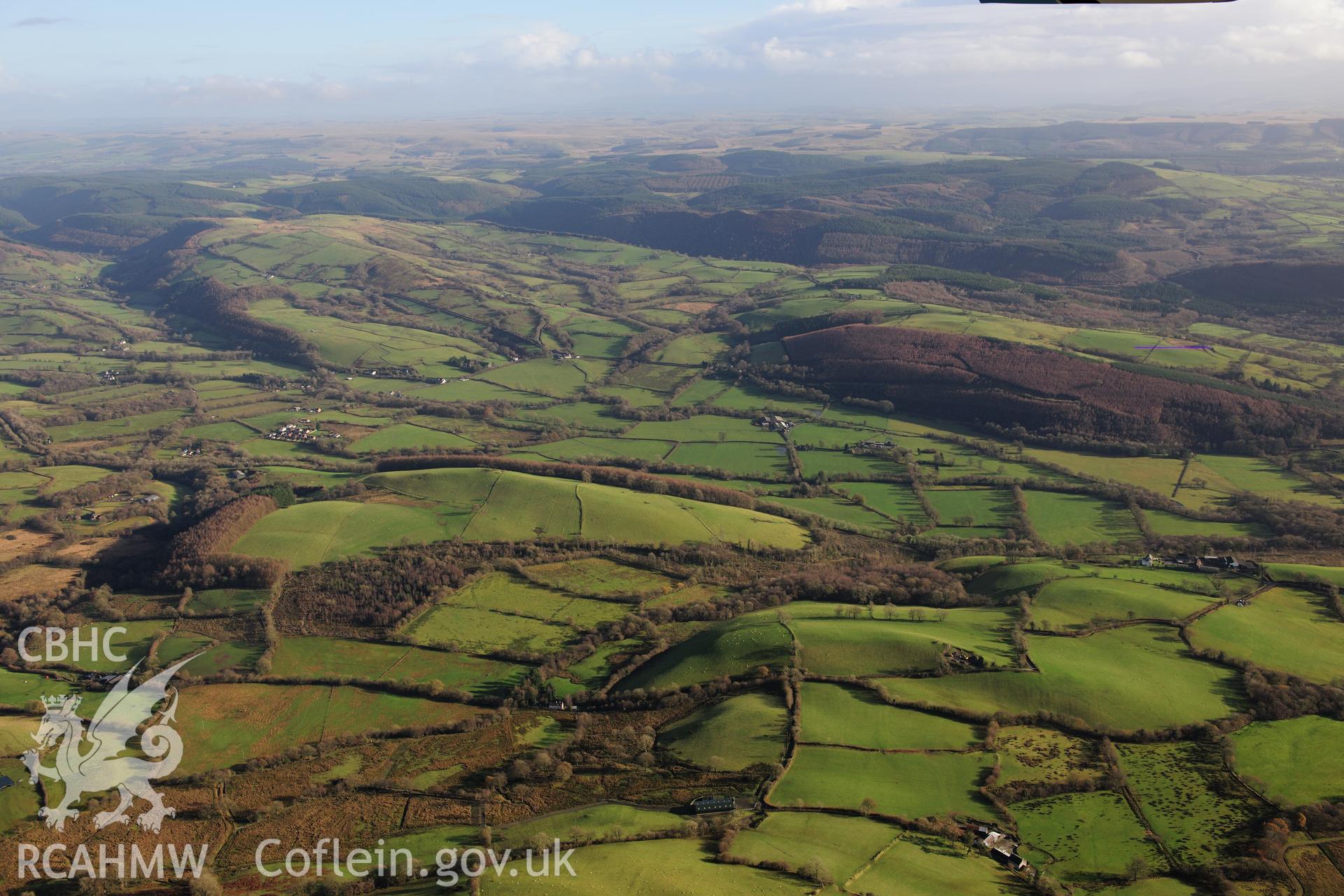 RCAHMW colour oblique photograph of Cynghordy, wide landscape view from west. Taken by Toby Driver on 23/11/2012.