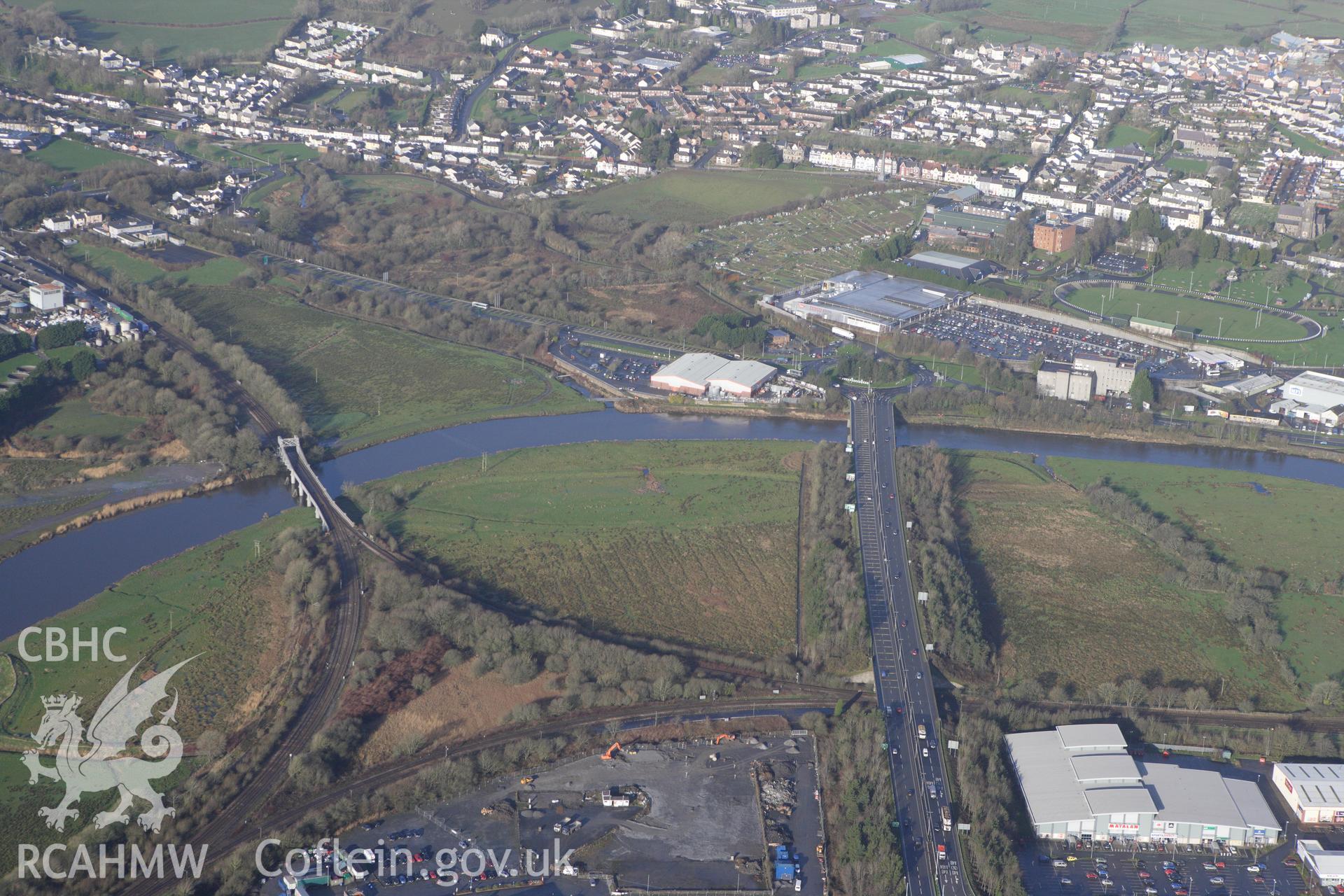 RCAHMW colour oblique photograph of View looking north-west towards Carmarthen across the River Towy, with Carmarthen park. Taken by Toby Driver on 27/01/2012.