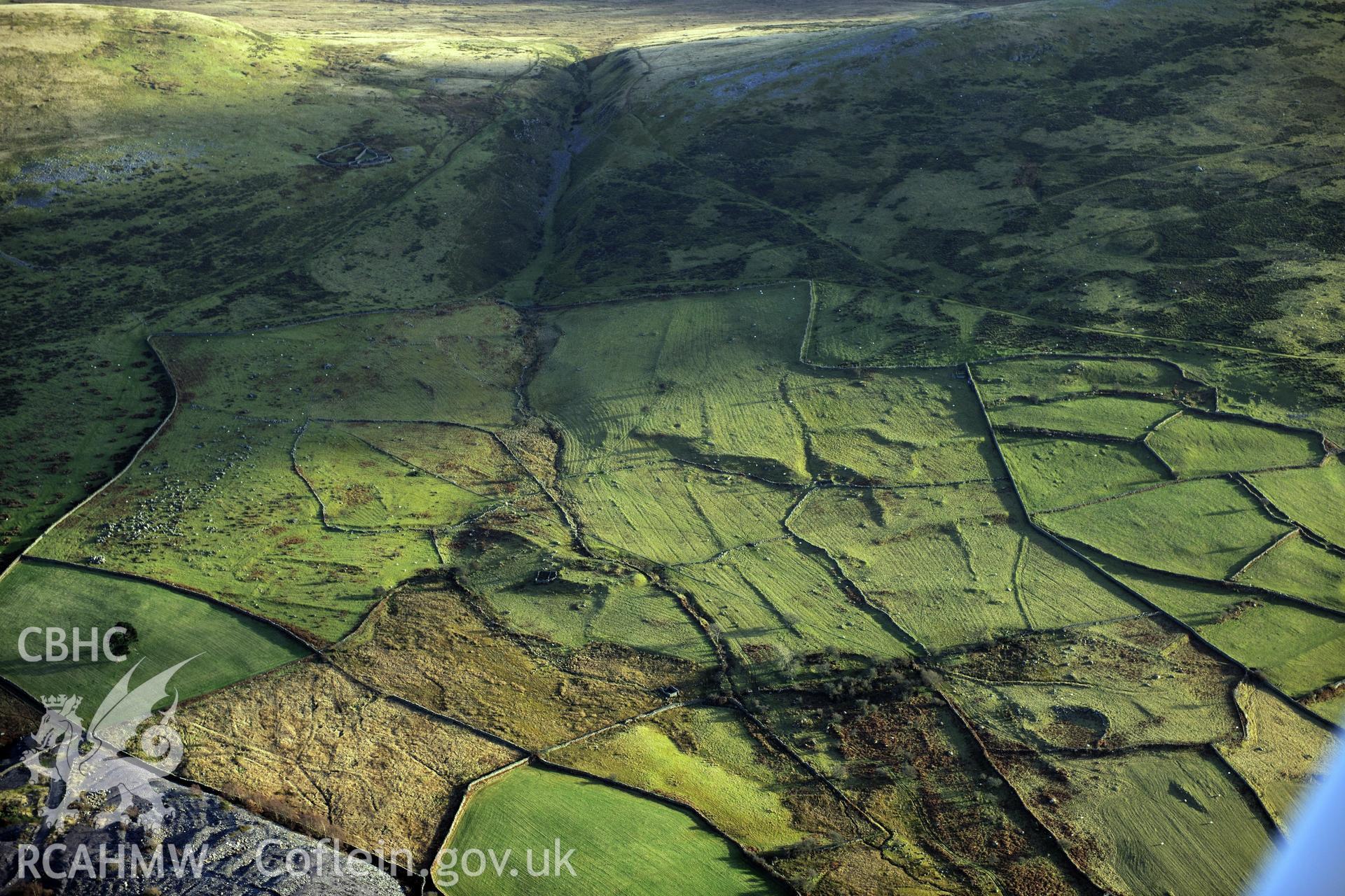 RCAHMW colour oblique photograph of Moel Faban early agricultural landscape, Llanllechid. Taken by Toby Driver on 10/12/2012.