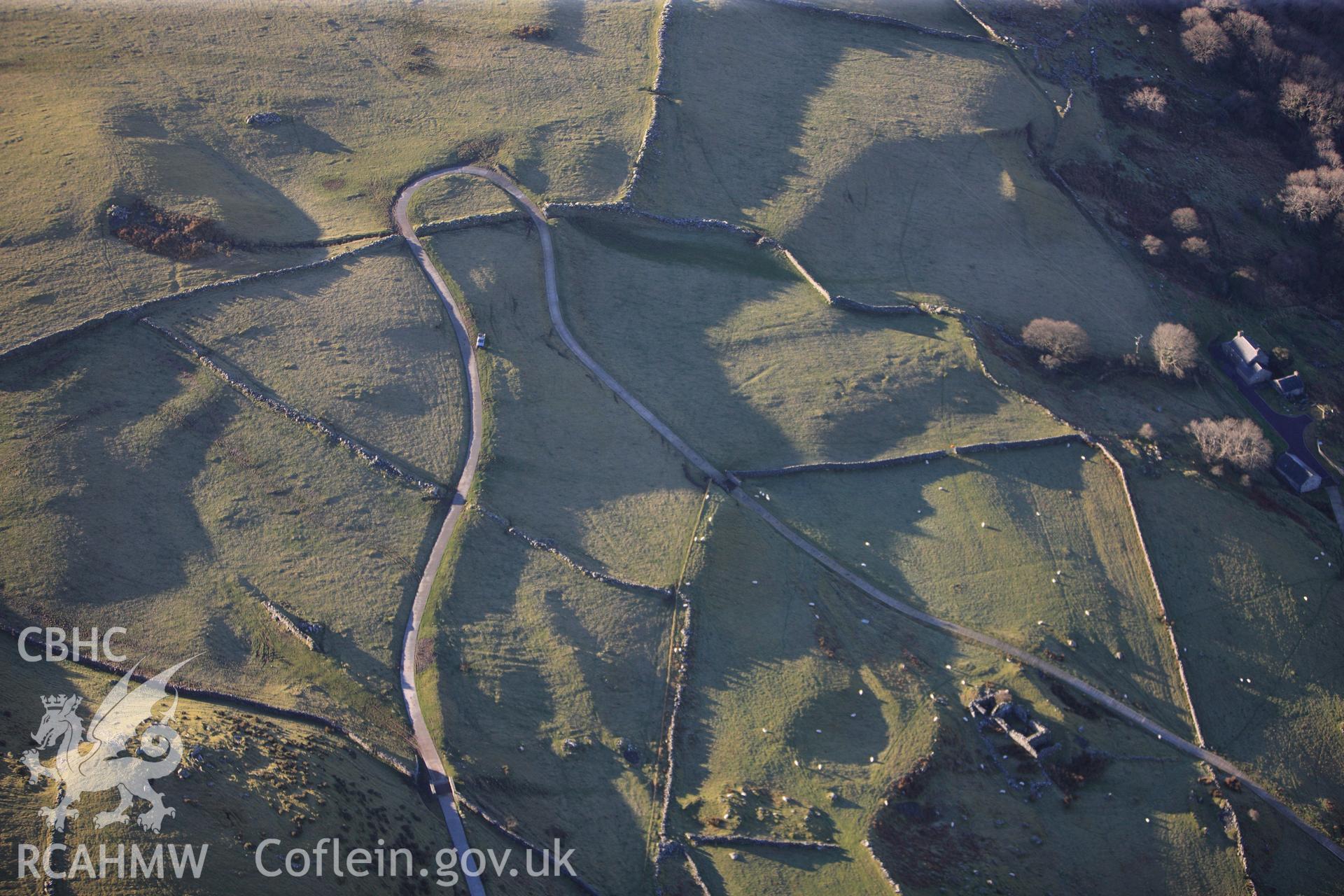 RCAHMW colour oblique photograph of Erw Wen, circular hut circle and field system. Taken by Toby Driver on 10/12/2012.