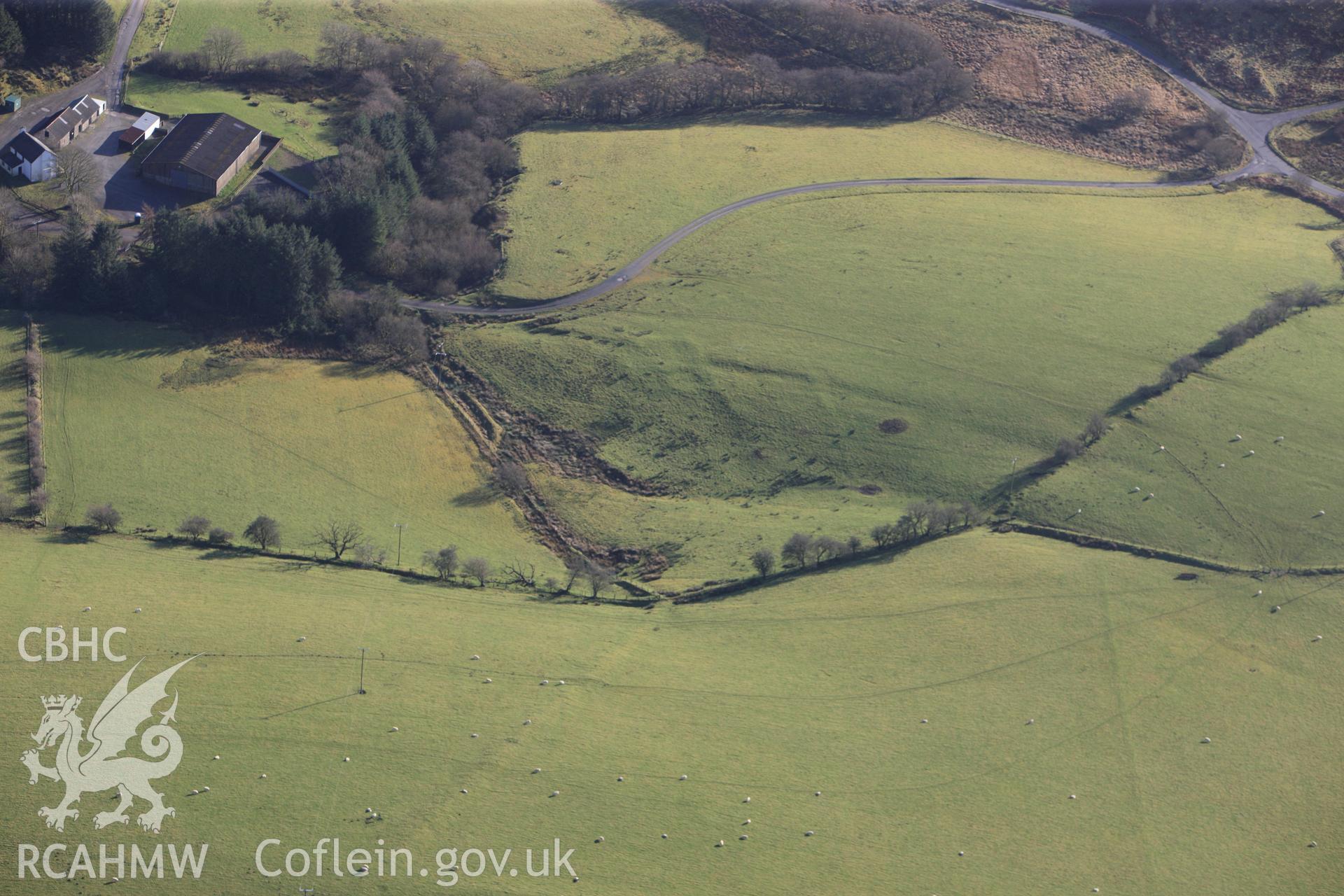 RCAHMW colour oblique photograph of Abererbwll Roman fortlet, undated earthworks 180m south of fortlet. Taken by Toby Driver on 23/11/2012.