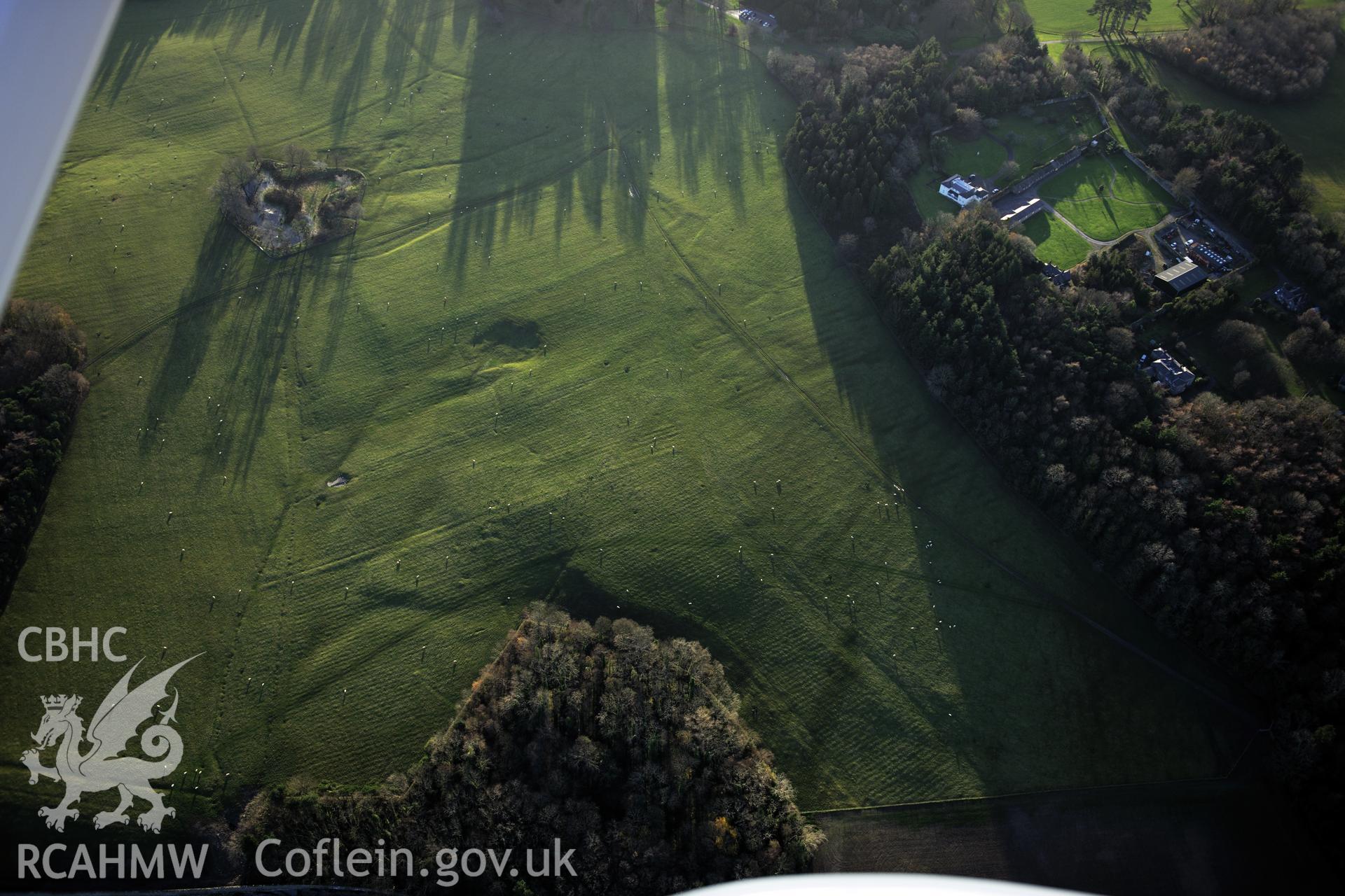 RCAHMW colour oblique photograph of Penrhyn Park earthworks, earthworks in north-east part of parkland. Taken by Toby Driver on 10/12/2012.
