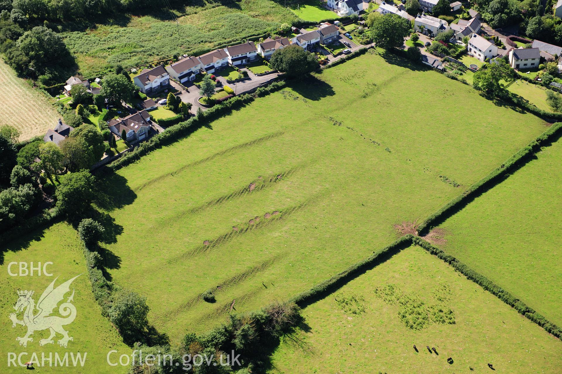RCAHMW colour oblique photograph of Llanblethian medieval strip fields, earthworks. Taken by Toby Driver on 24/07/2012.