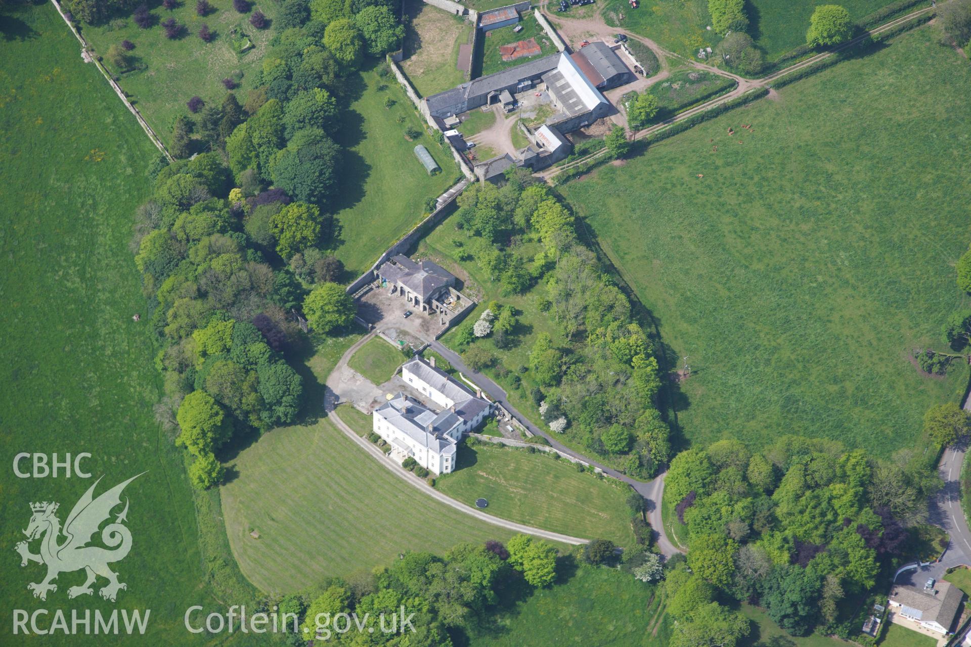 RCAHMW colour oblique photograph of General view of Plas Llanstephan house and garden, looking south west. Taken by Toby Driver on 24/05/2012.