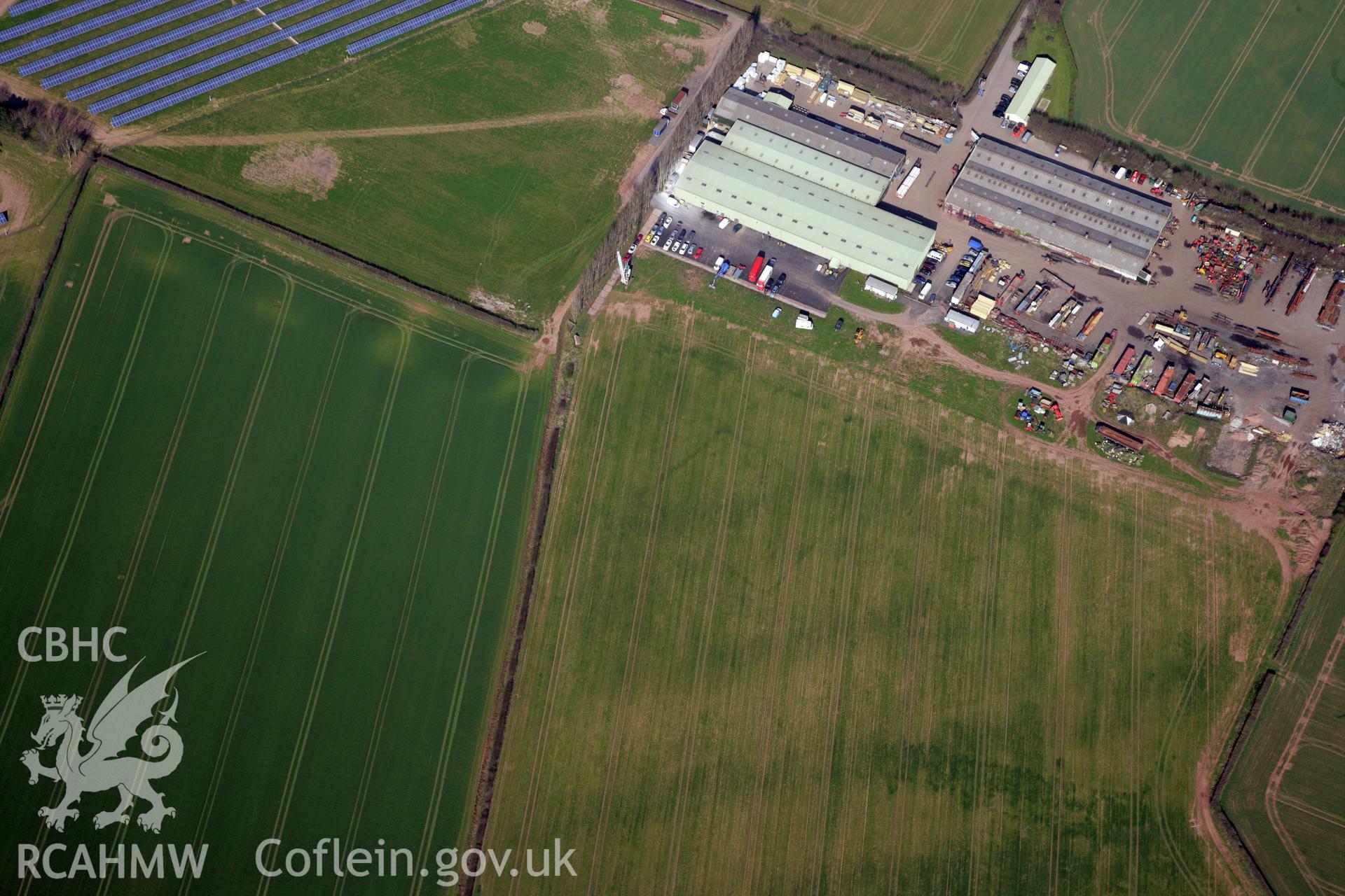 RCAHMW colour oblique photograph of Llancayo Farm defended enclosure cropmarks. Taken by Toby Driver and Oliver Davies on 28/03/2012.