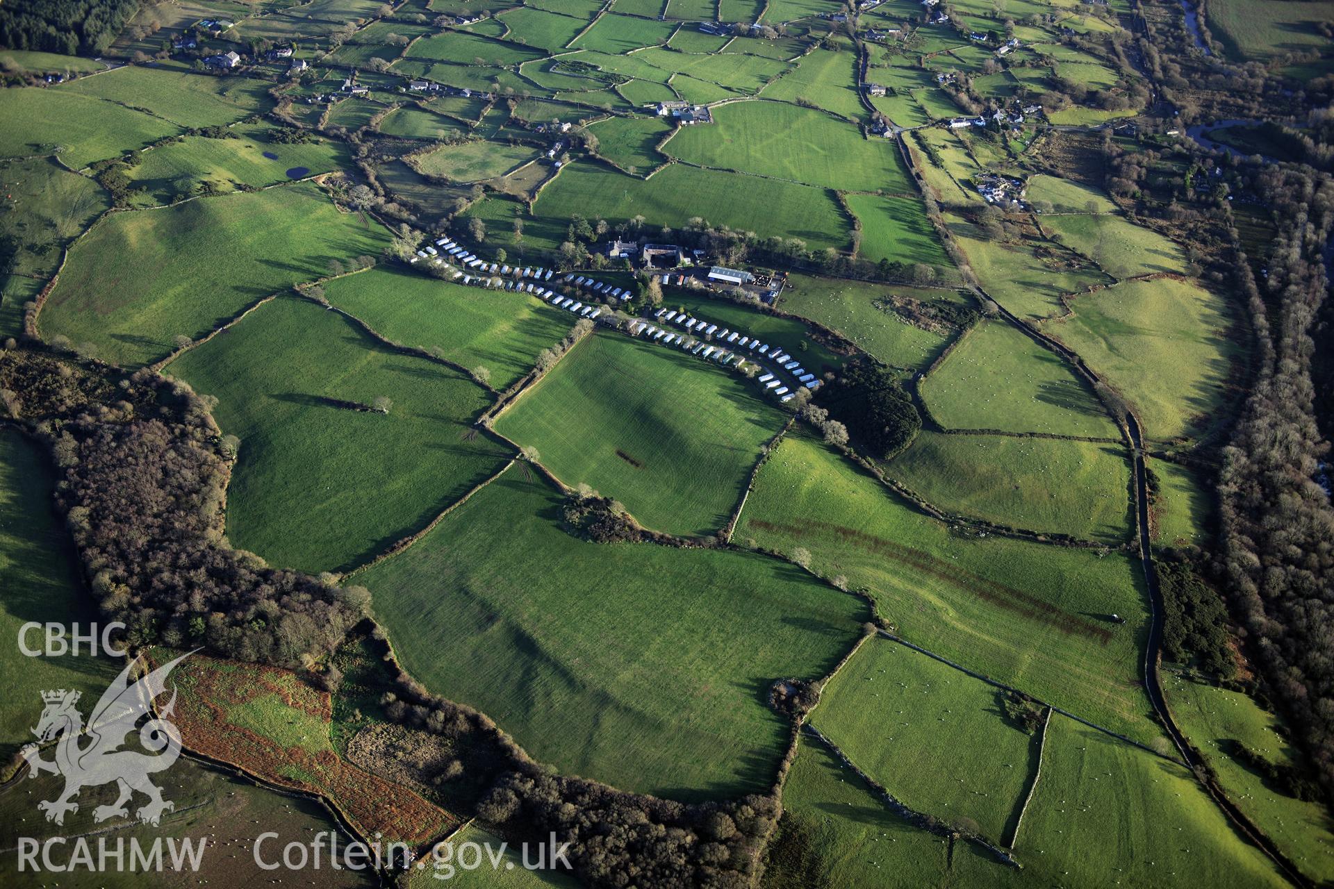 RCAHMW colour oblique photograph of Pen y Gaer settlements and field systems, looking south-east over Glascoed Hall. Taken by Toby Driver on 10/12/2012.