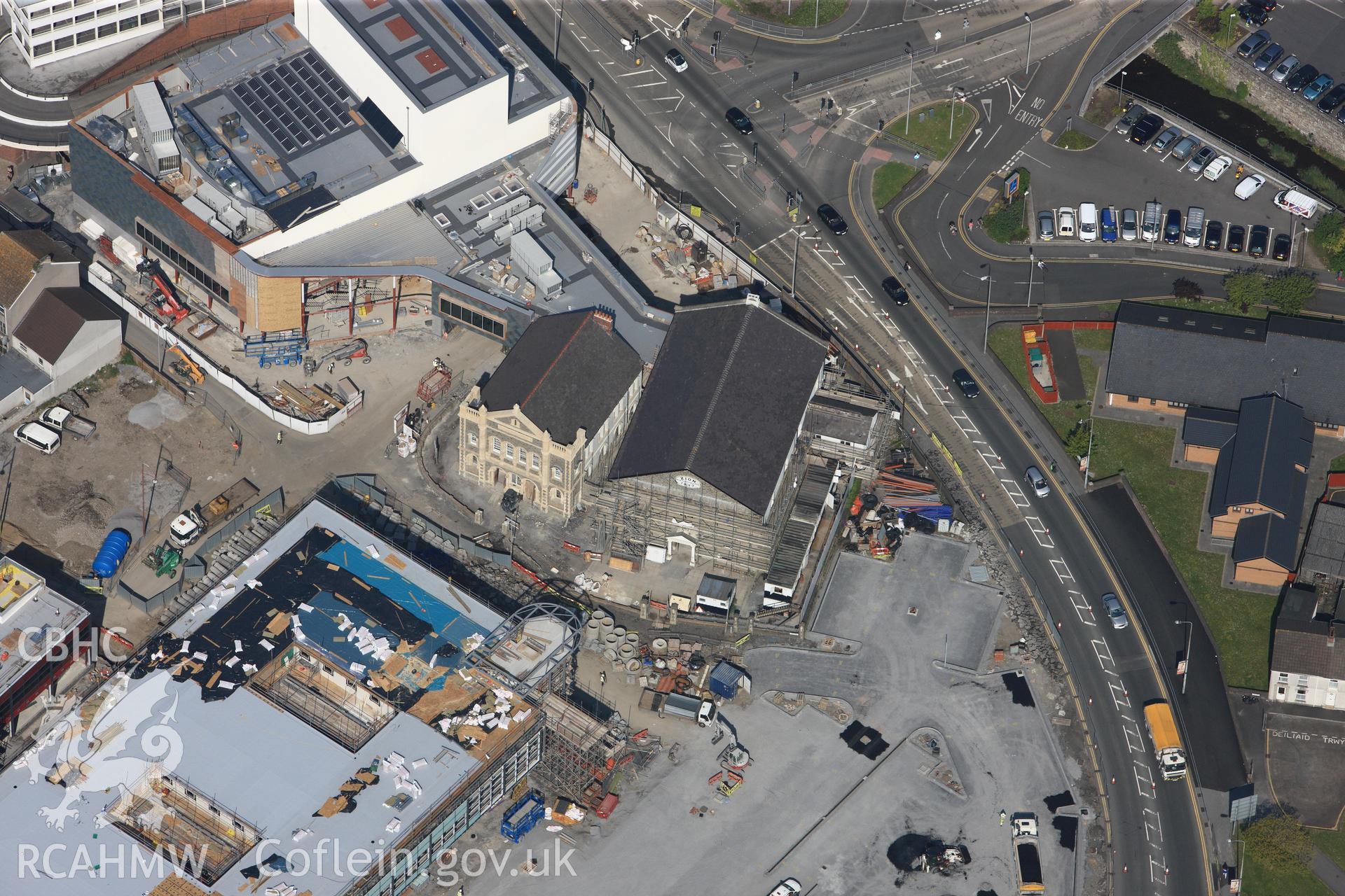 RCAHMW colour oblique photograph of General view of construction work adjacent to Zion Welsh Baptist Chapel, looking north west. Taken by Toby Driver on 24/05/2012.
