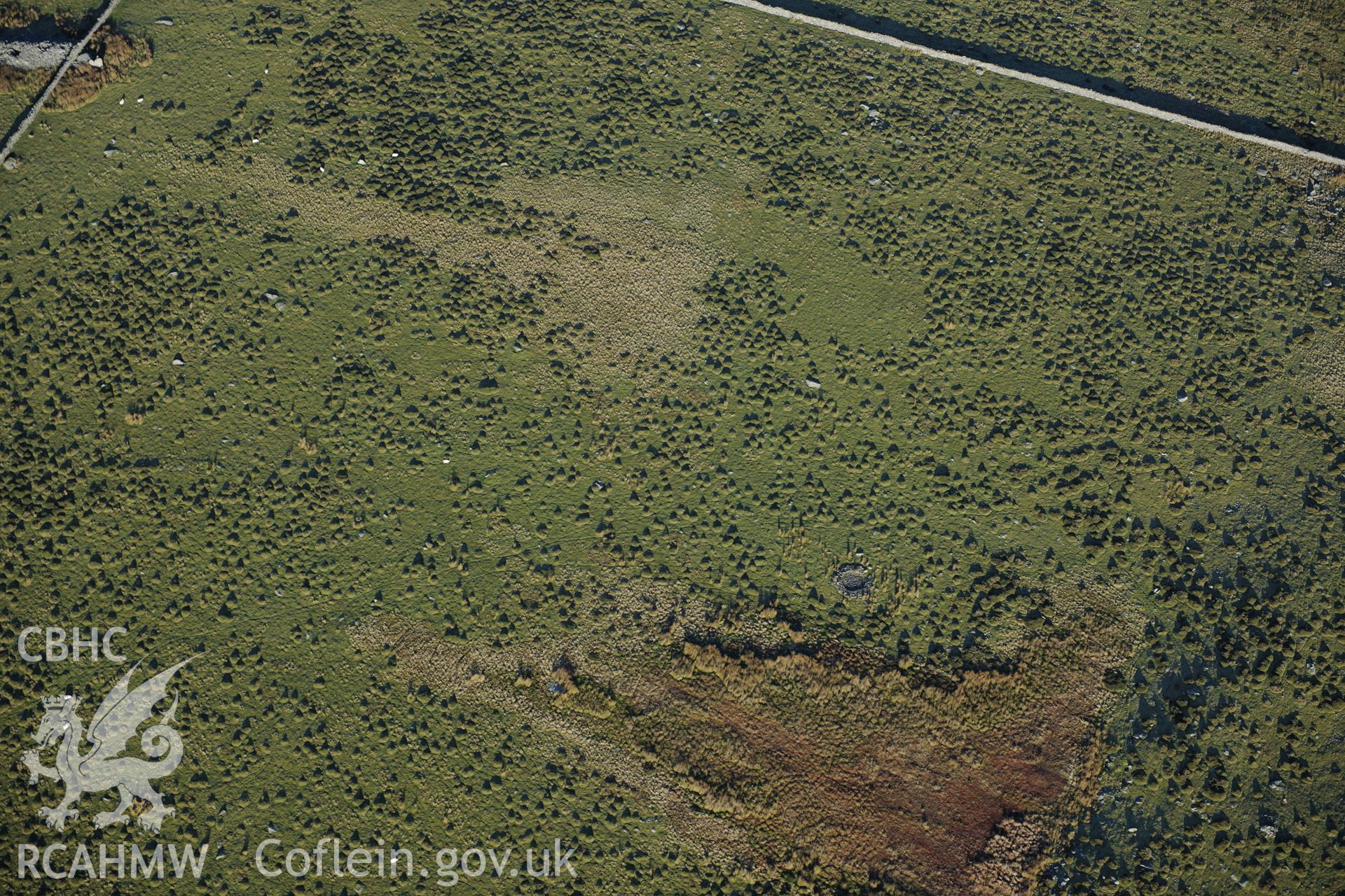RCAHMW colour oblique photograph of Mynydd Egryn, excavated hut circle. Taken by Toby Driver on 10/12/2012.