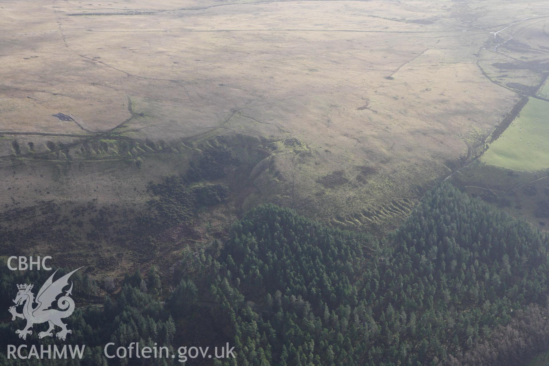 RCAHMW colour oblique photograph of old quarry workings on the lower slopes of Tor Clawdd, above the Upper Lliw reservoir. Taken by Toby Driver on 27/01/2012.