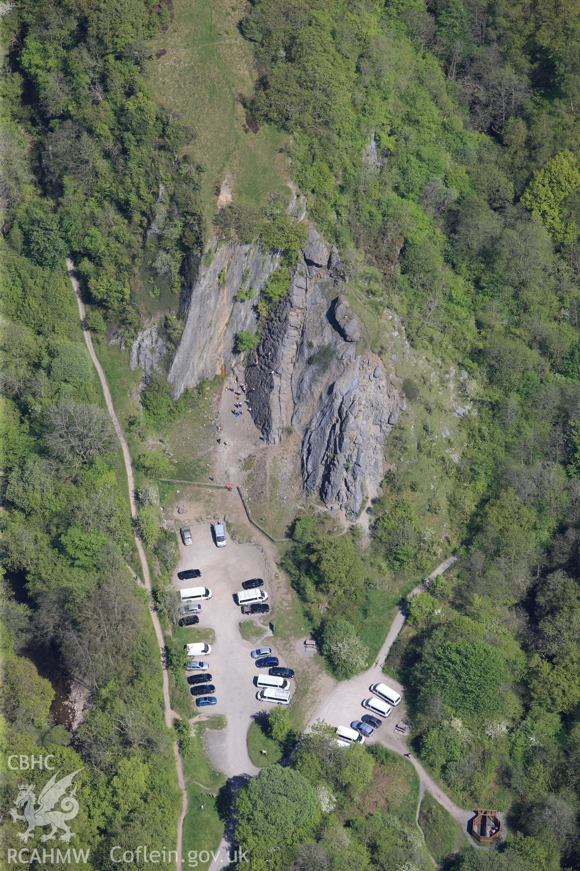 RCAHMW colour oblique photograph of Glyn Neath Black Powder works, car park near entrance lodge, with climbers. Taken by Toby Driver on 22/05/2012.