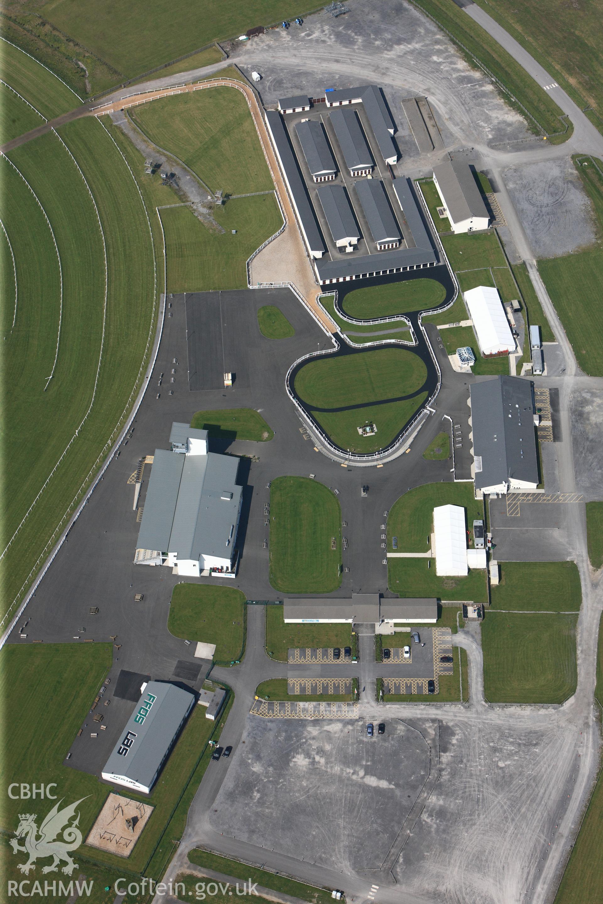 RCAHMW colour oblique photograph of General view of buildings at Ffos Las racecourse, looking north west. Taken by Toby Driver on 24/05/2012.