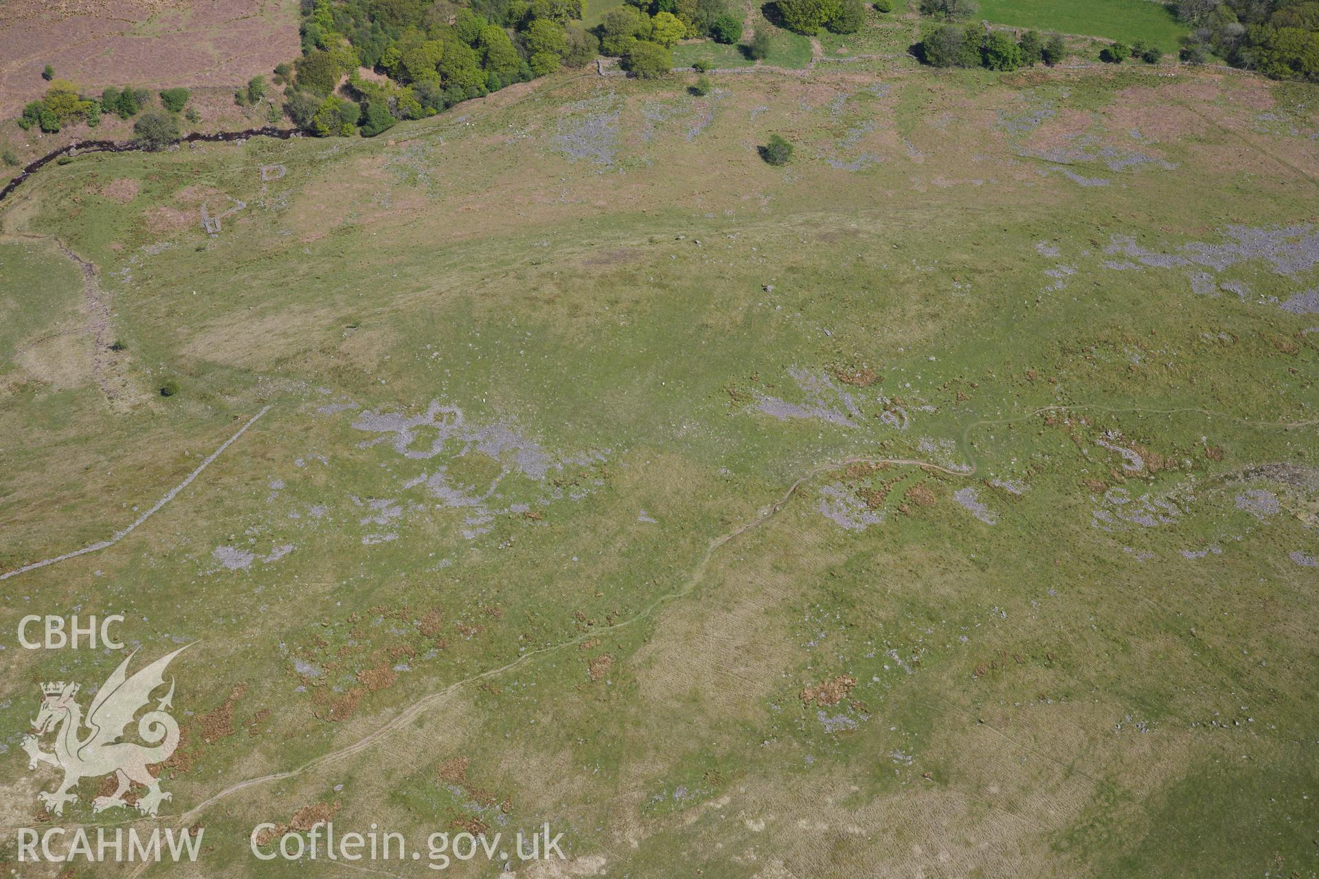 RCAHMW colour oblique photograph of Allt Fach, enclosure complex. Taken by Toby Driver on 22/05/2012.