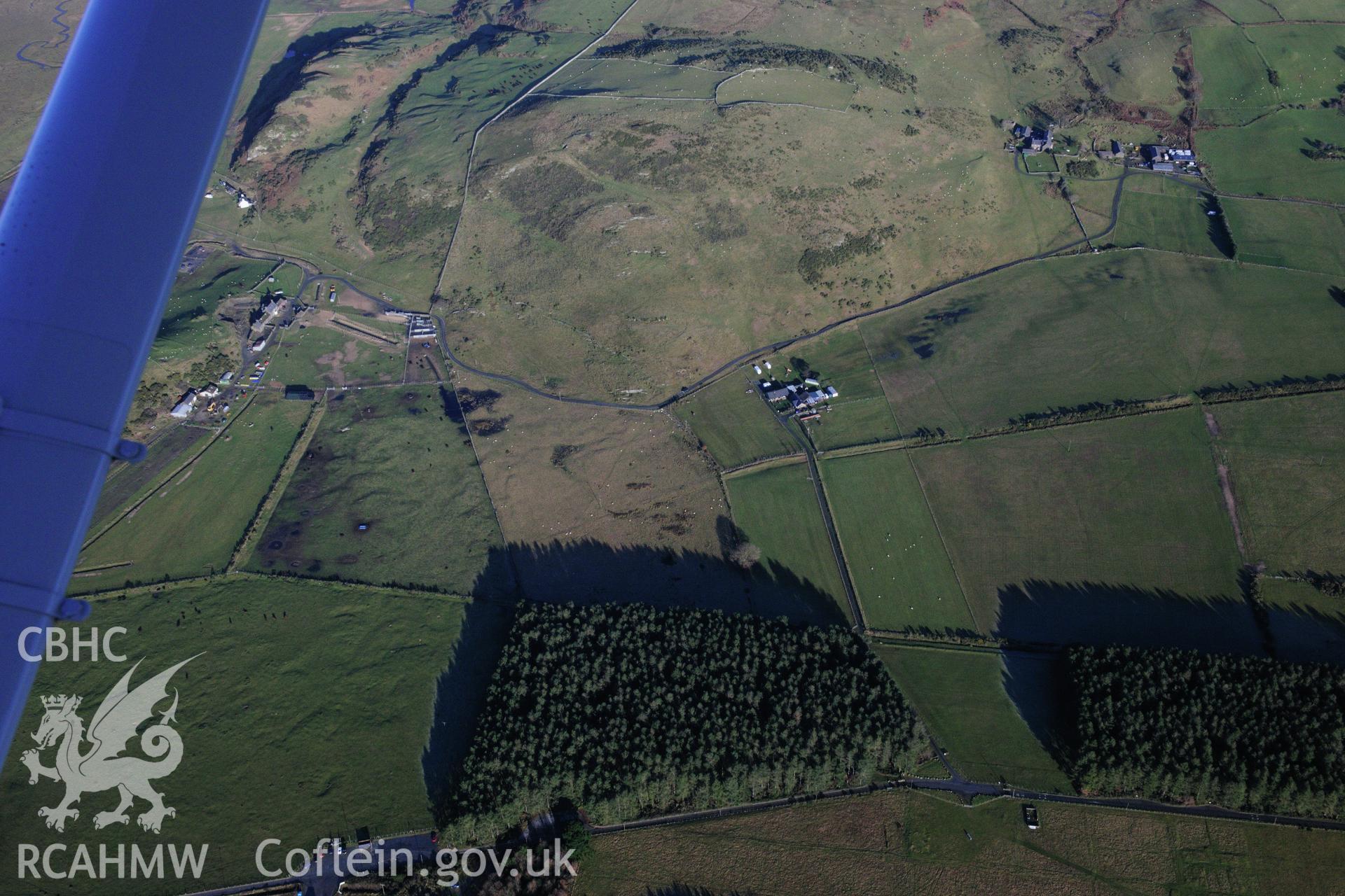 RCAHMW colour oblique photograph of Tanforhesgan earthwork enclosure. Taken by Toby Driver on 10/12/2012.