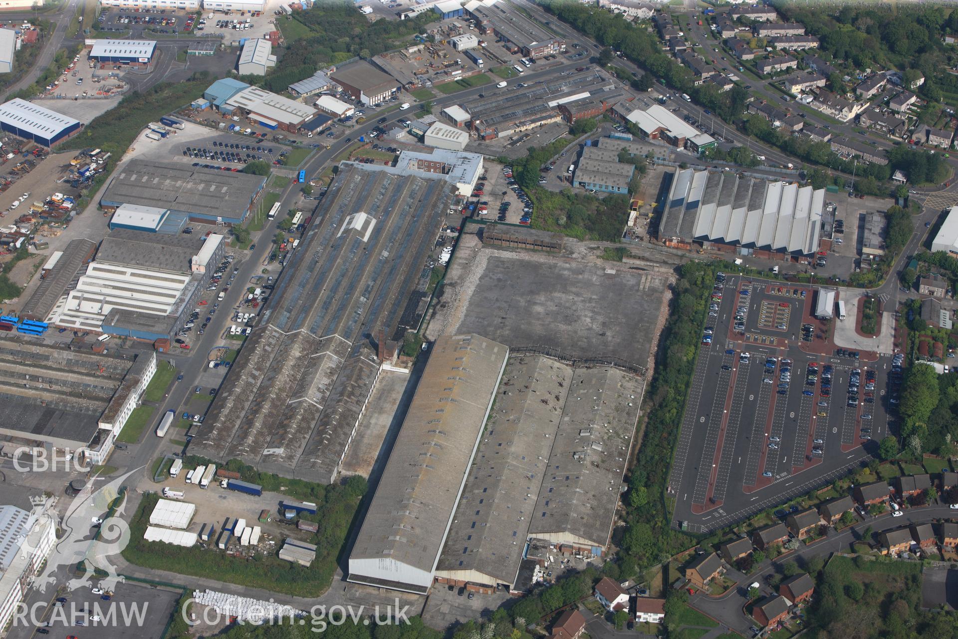 RCAHMW colour oblique photograph of General view of Swansea West Industrial Estate looking north west towards former War Materials factory. Taken by Toby Driver on 24/05/2012.