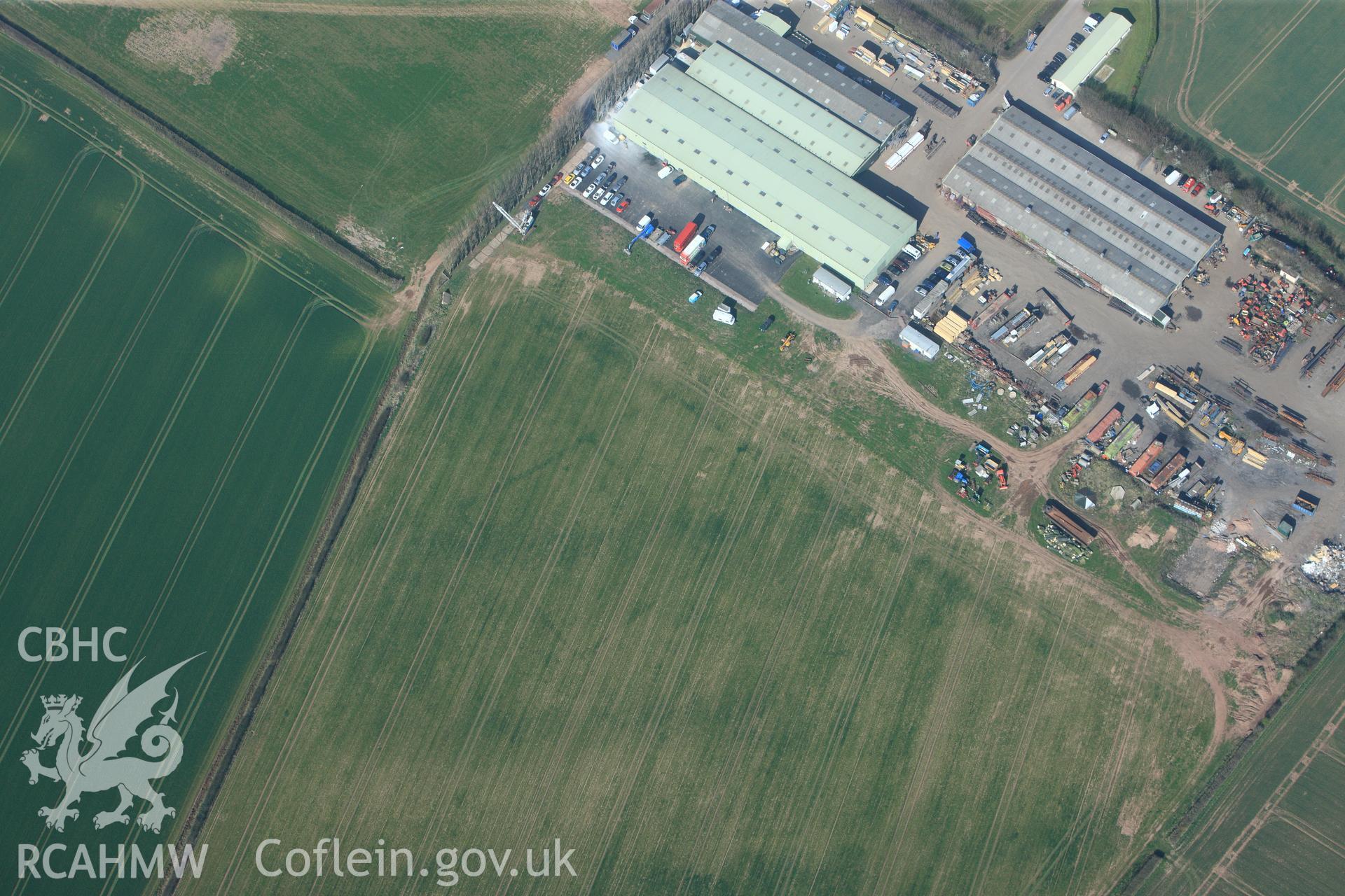 RCAHMW colour oblique photograph of Llancayo Farm defended enclosure cropmarks. Taken by Toby Driver and Oliver Davies on 28/03/2012.