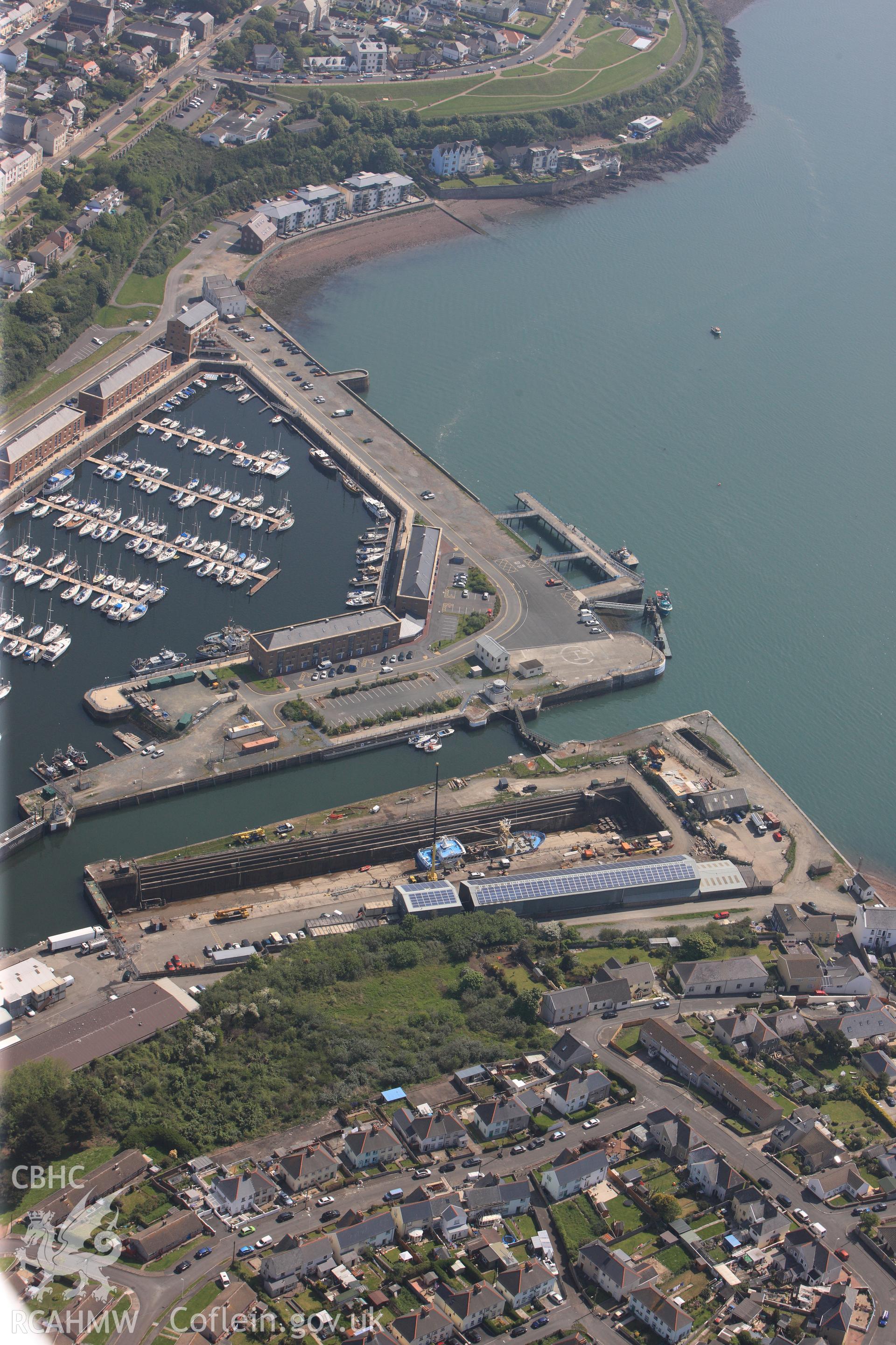 RCAHMW colour oblique photograph of General view of Milford Haven docks and marina, looking east. Taken by Toby Driver on 24/05/2012.