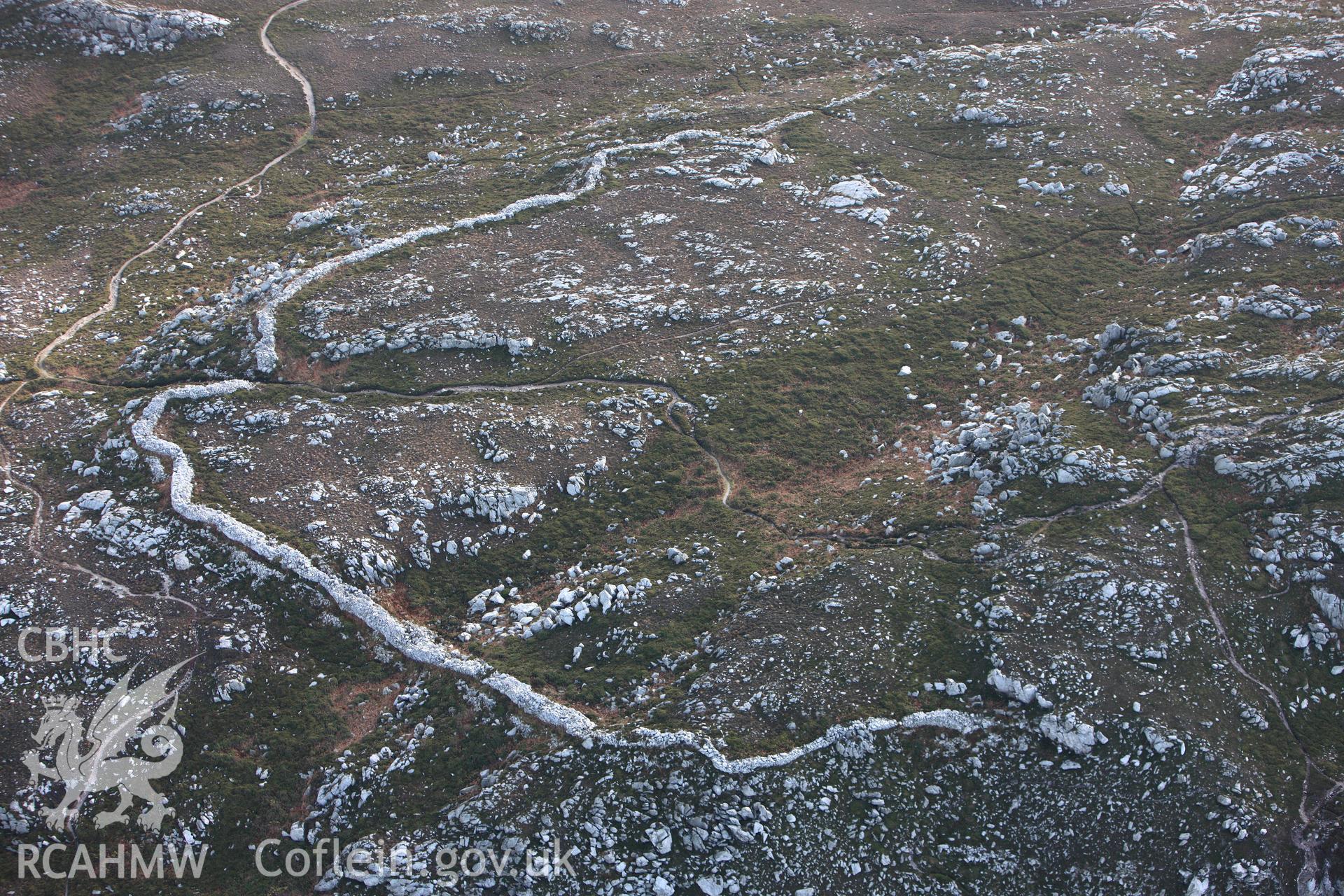 RCAHMW colour oblique photograph of Caer y Twr hillfort, Holyhead Mountain. Taken by Toby Driver on 13/01/2012.