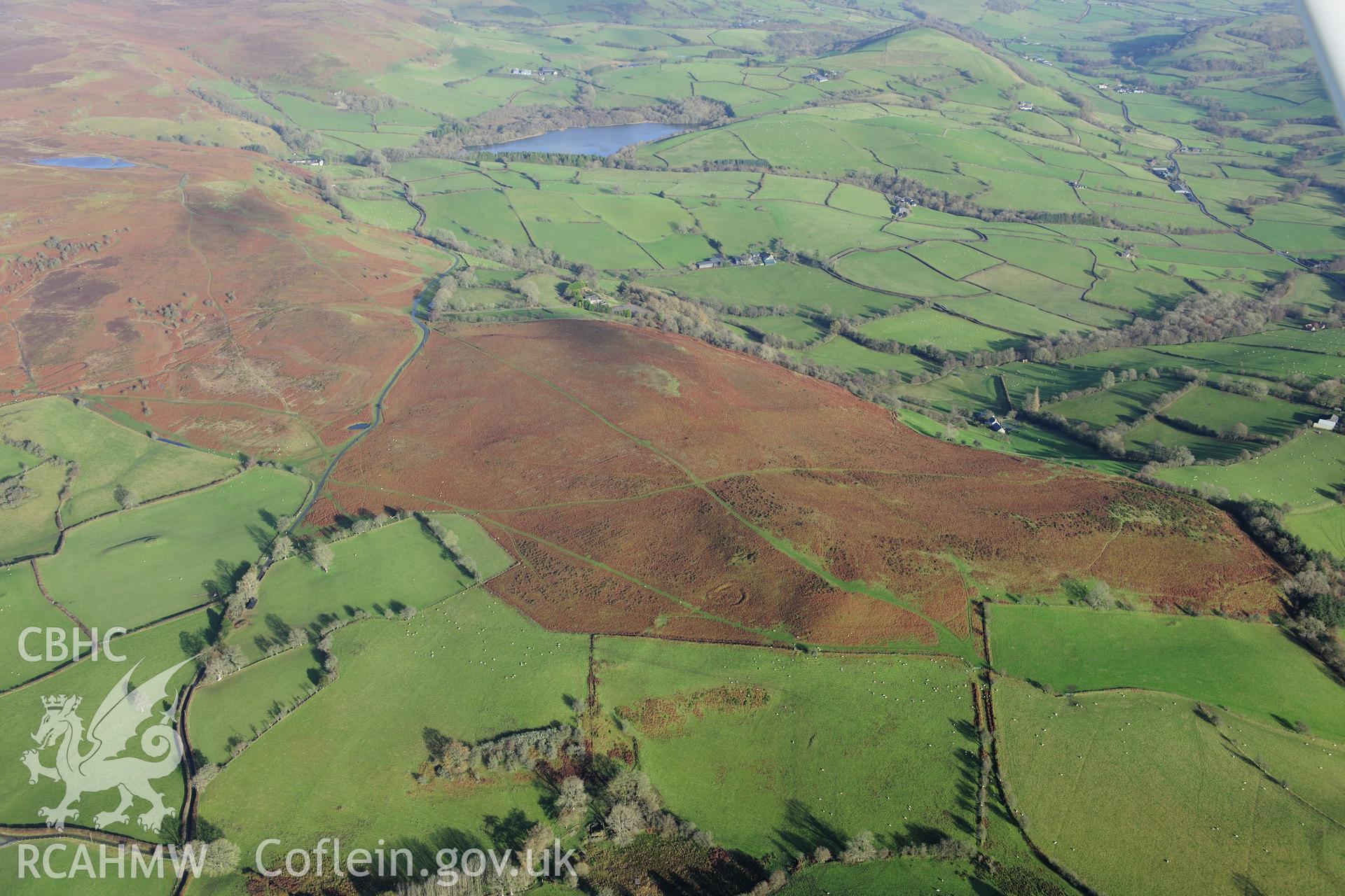 RCAHMW colour oblique photograph of Luck House, enclosure and upland landscape, from south-west. Taken by Toby Driver on 23/11/2012.