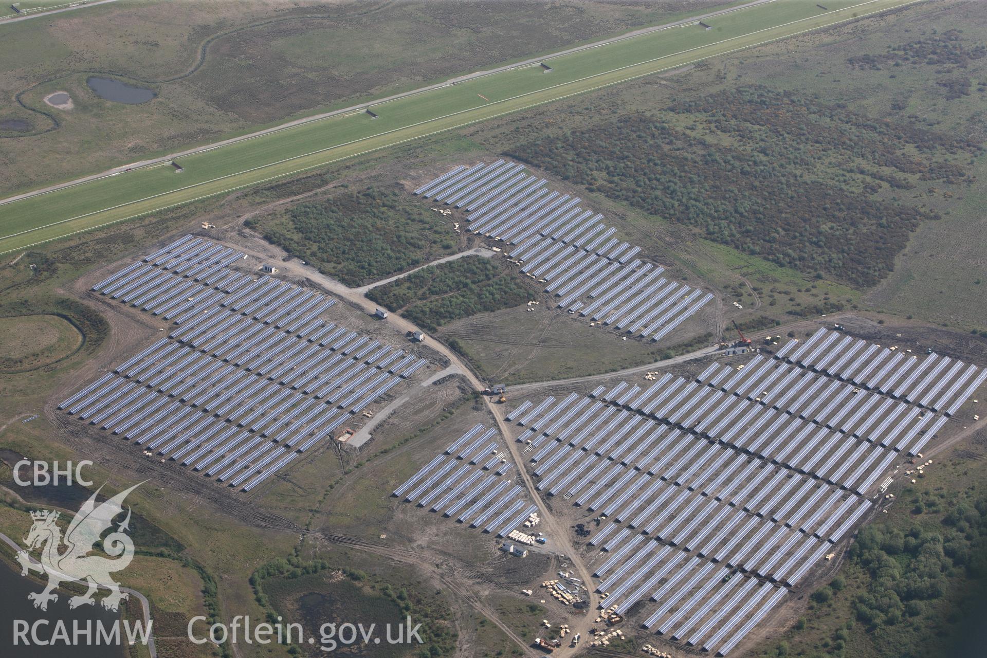 RCAHMW colour oblique photograph of General view of solar farm south of Ffos Las racecourse, looking north east. Taken by Toby Driver on 24/05/2012.