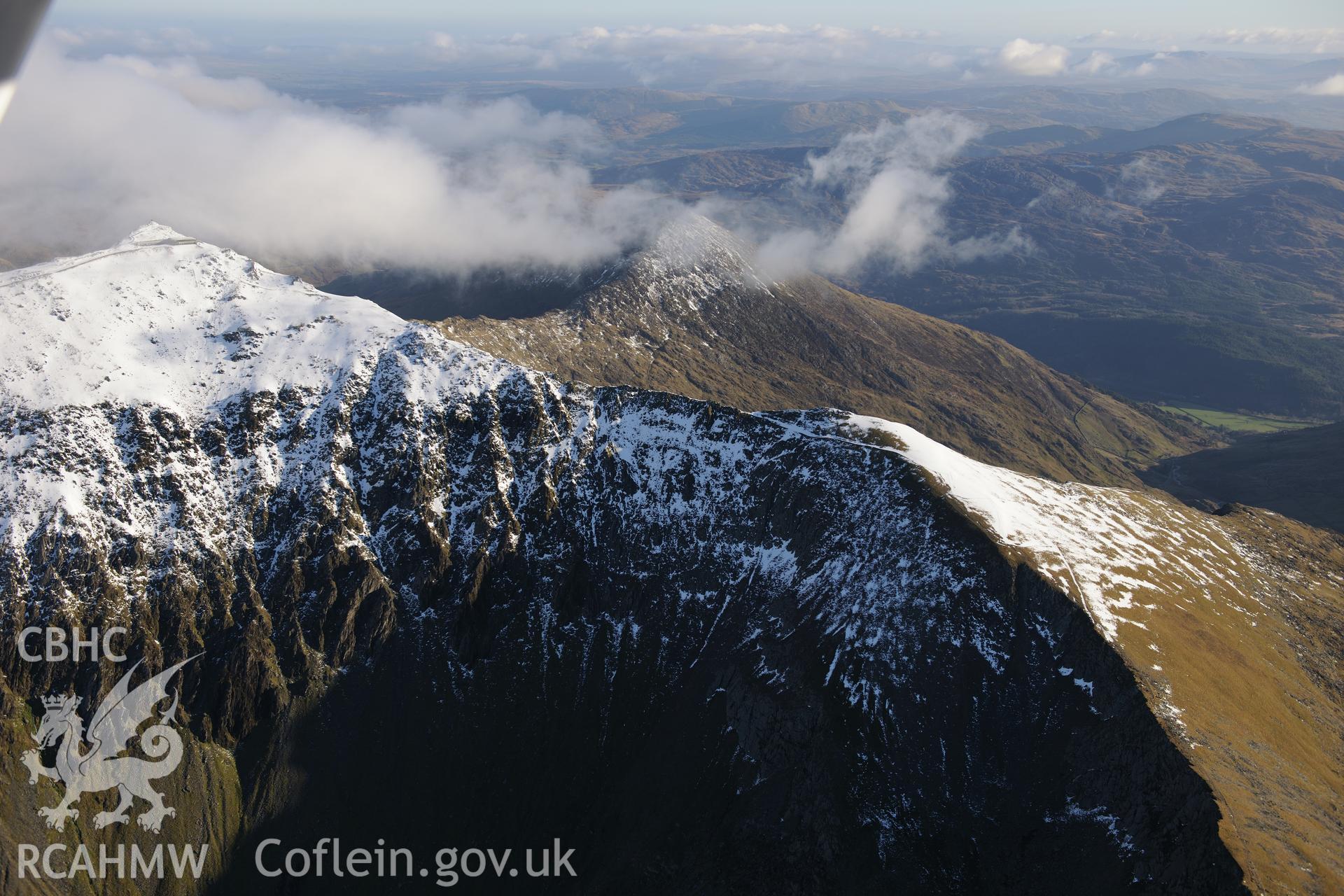 RCAHMW colour oblique photograph of Snowdon range, with Snowdon summit and Bwlch Main from the northwest, under snow. Taken by Toby Driver on 10/12/2012.