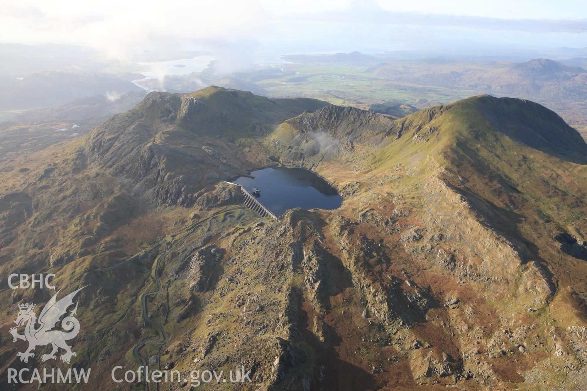 RCAHMW colour oblique photograph of Llyn Stwlan reservoir, with Moelwyn slate quarry. Taken by Toby Driver on 13/01/2012.