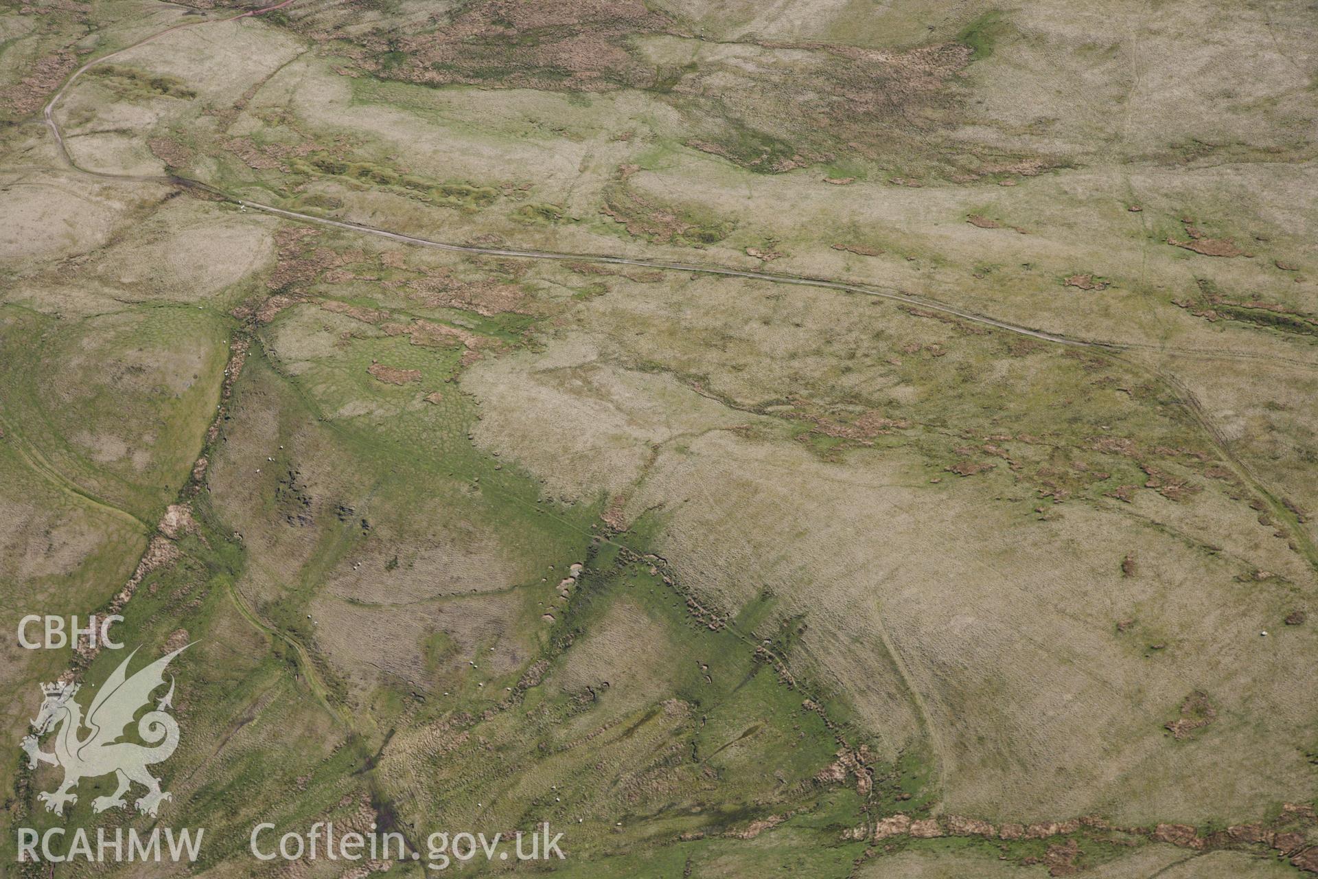 RCAHMW colour oblique photograph of Pen y Bylchau ring cairn. Taken by Toby Driver on 22/05/2012.