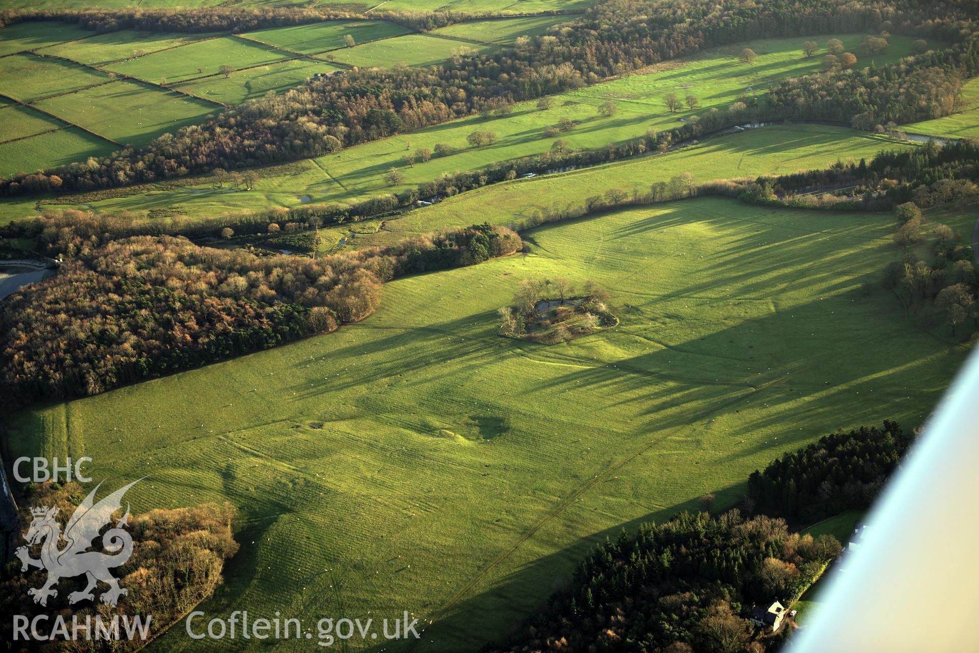 RCAHMW colour oblique photograph of Penrhyn Park earthworks, earthworks in north-east part of parkland. Taken by Toby Driver on 10/12/2012.