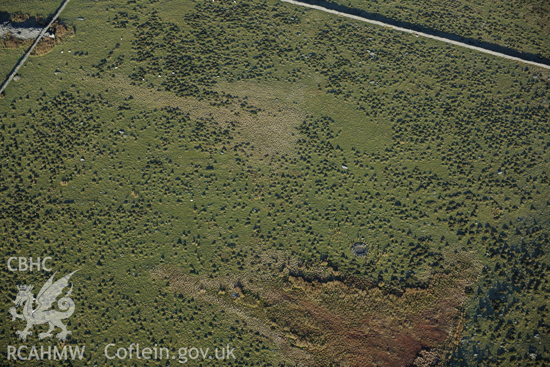 RCAHMW colour oblique photograph of Mynydd Egryn, excavated hut circle. Taken by Toby Driver on 10/12/2012.
