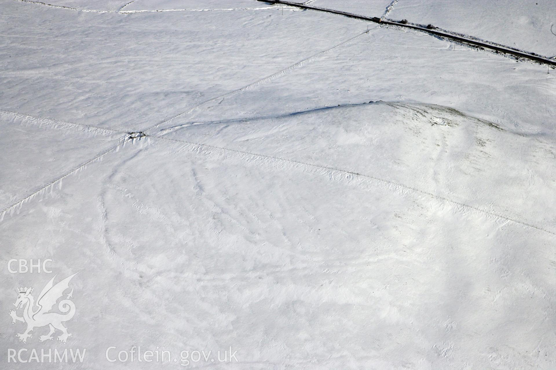 RCAHMW colour oblique photograph of Banc Du Neolithic Enclosure. Taken by Toby Driver on 02/02/2012.