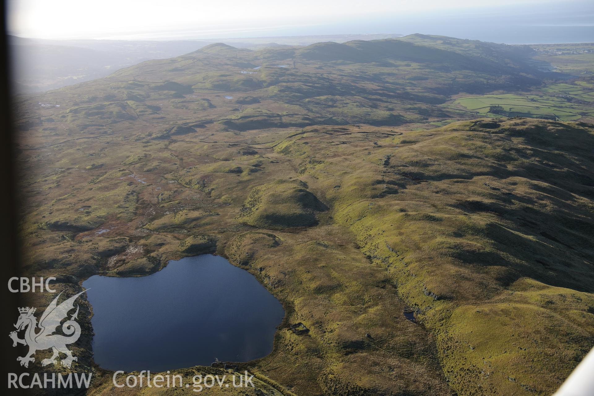 RCAHMW colour oblique photograph of Llyn Caerwch, landscape looking south towards cairnfield. Taken by Toby Driver on 10/12/2012.