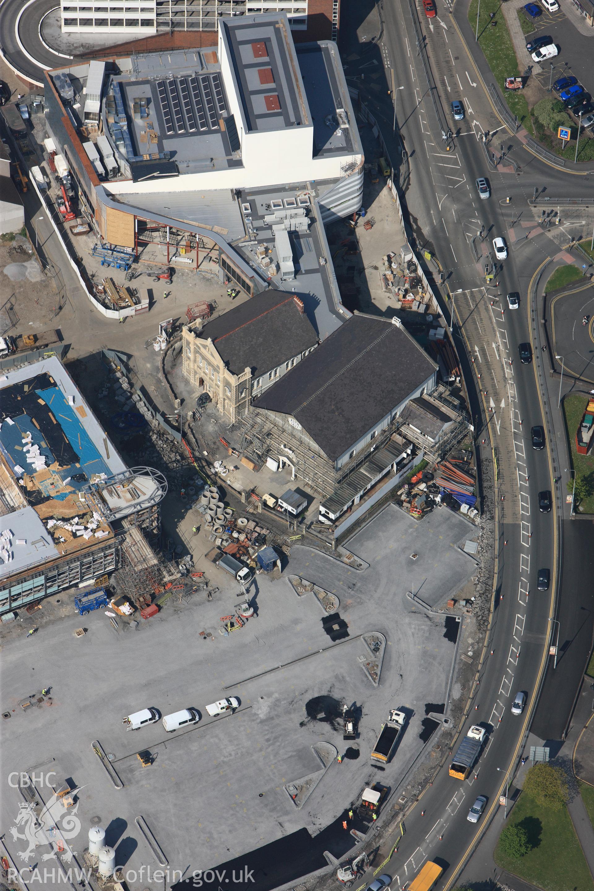 RCAHMW colour oblique photograph of General view of construction work adjacent to Zion Welsh Baptist Chapel, looking west. Taken by Toby Driver on 24/05/2012.