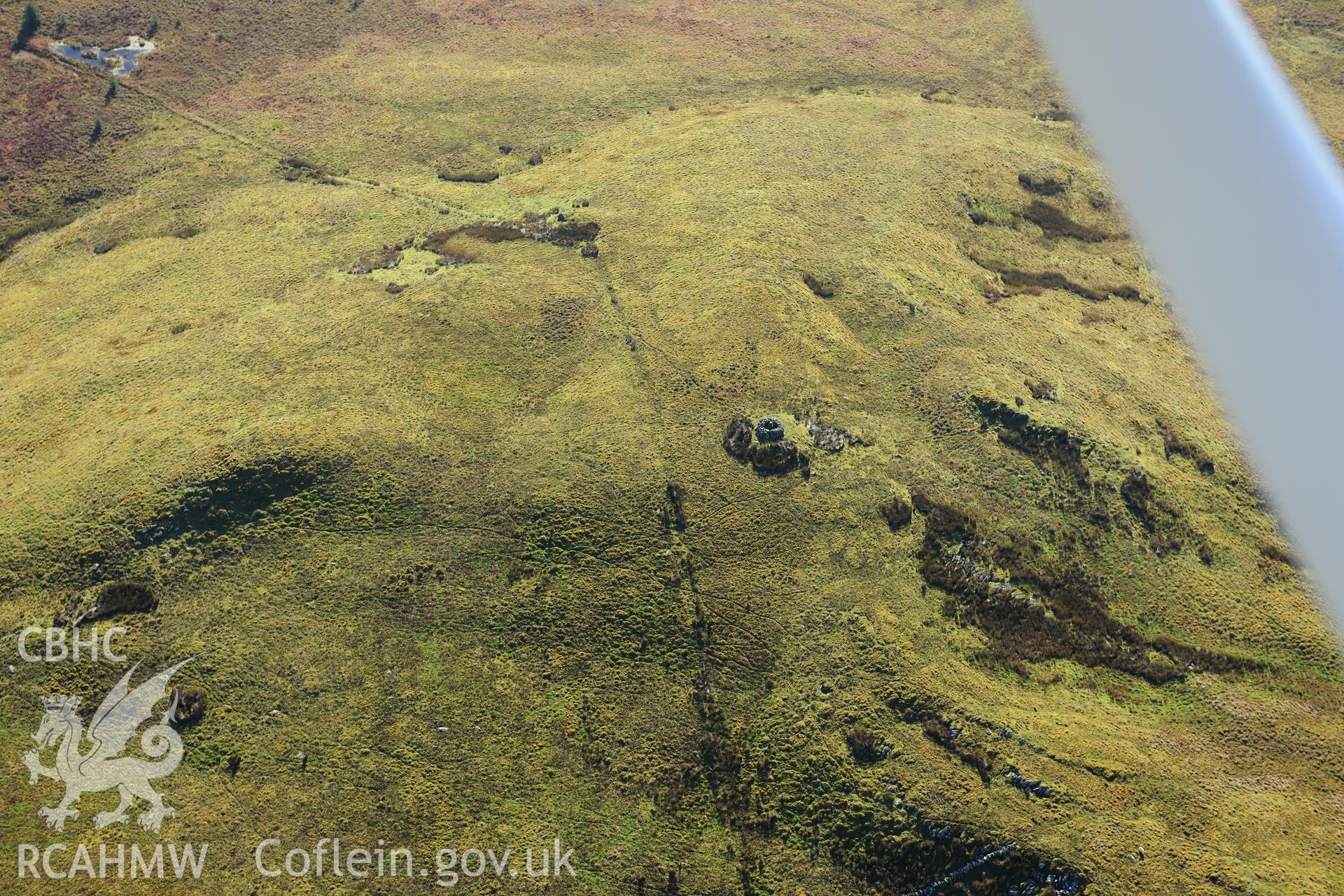 RCAHMW colour oblique photograph of Crug, cairn, in winter landscape. Taken by Toby Driver on 05/11/2012.