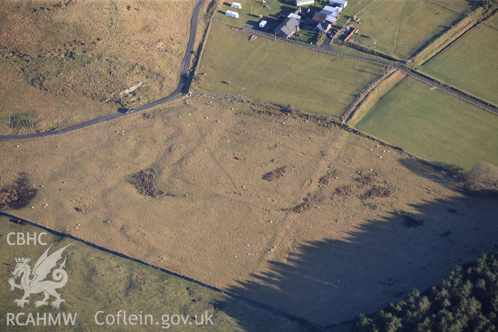 RCAHMW colour oblique photograph of Tanforhesgan earthwork enclosure. Taken by Toby Driver on 10/12/2012.