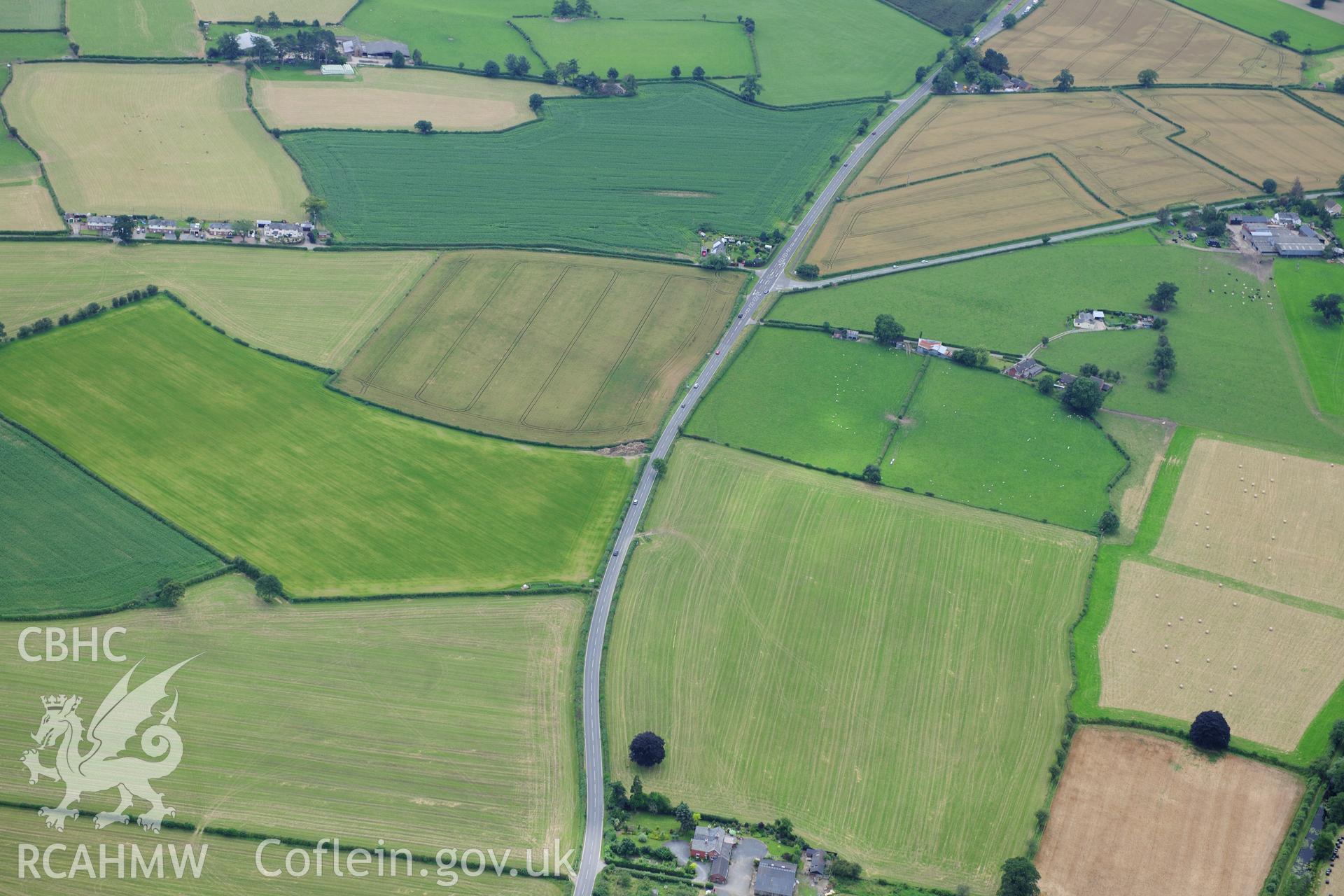 RCAHMW colour oblique photograph of Lower Luggy cursus, Dyffryn Lane, cropmarks. Taken by Toby Driver on 27/07/2012.