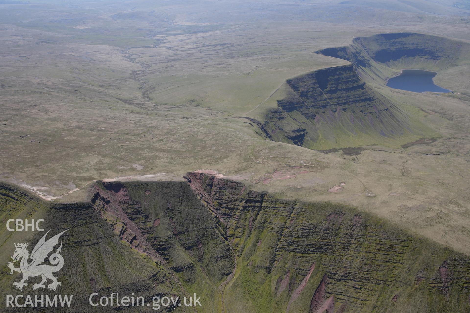 RCAHMW colour oblique photograph of Fan Foel round barrow, in landscape. Taken by Toby Driver on 22/05/2012.
