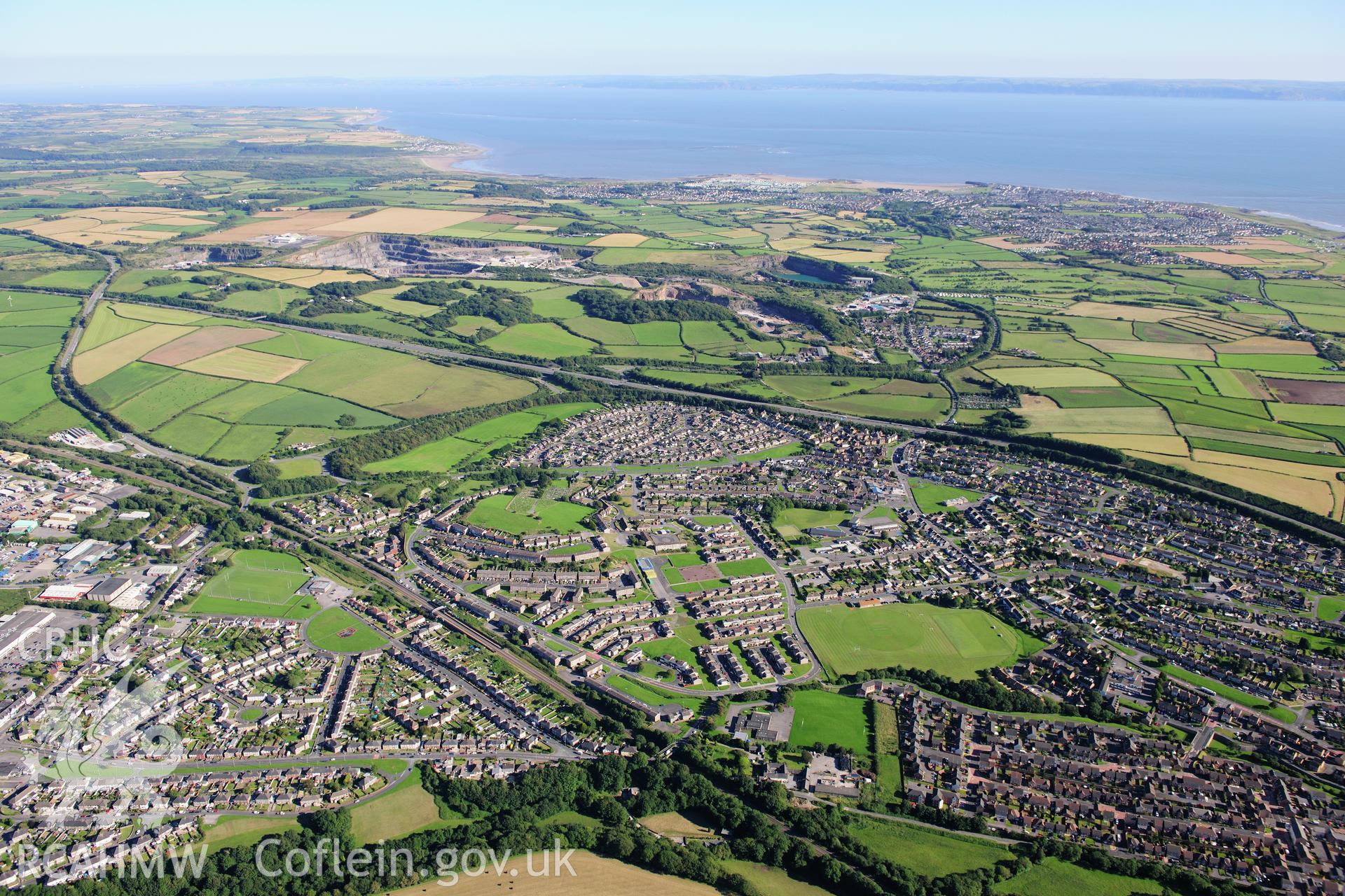 RCAHMW colour oblique photograph of Pyle, general view from north-west. Taken by Toby Driver on 24/07/2012.