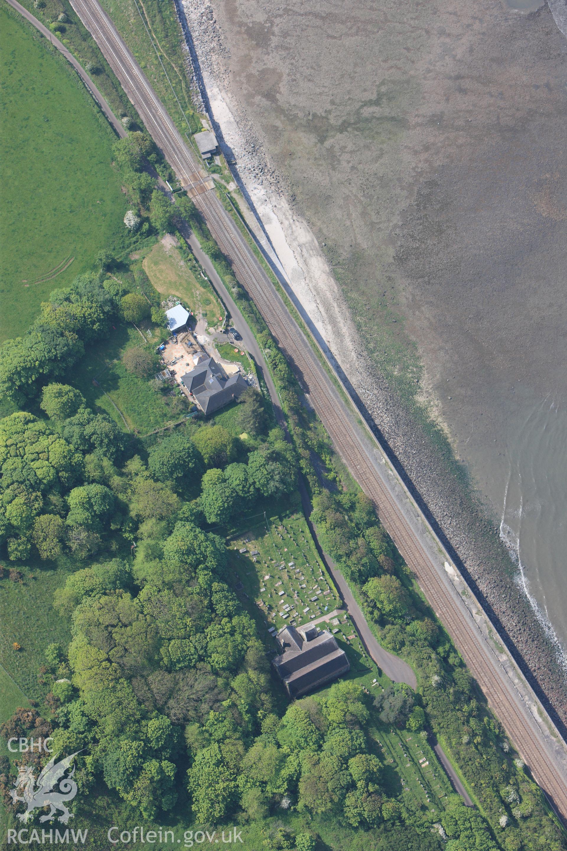 RCAHMW colour oblique photograph of General view of St Ishmael's Church, looking south west. Taken by Toby Driver on 24/05/2012.