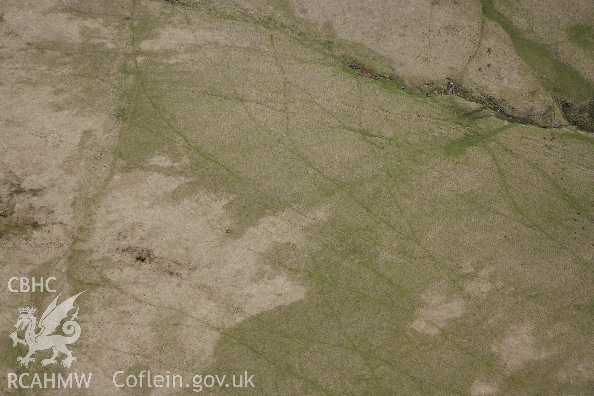 RCAHMW colour oblique photograph of Bannau sir gaer stone circle, possible missed target. Taken by Toby Driver on 22/05/2012.
