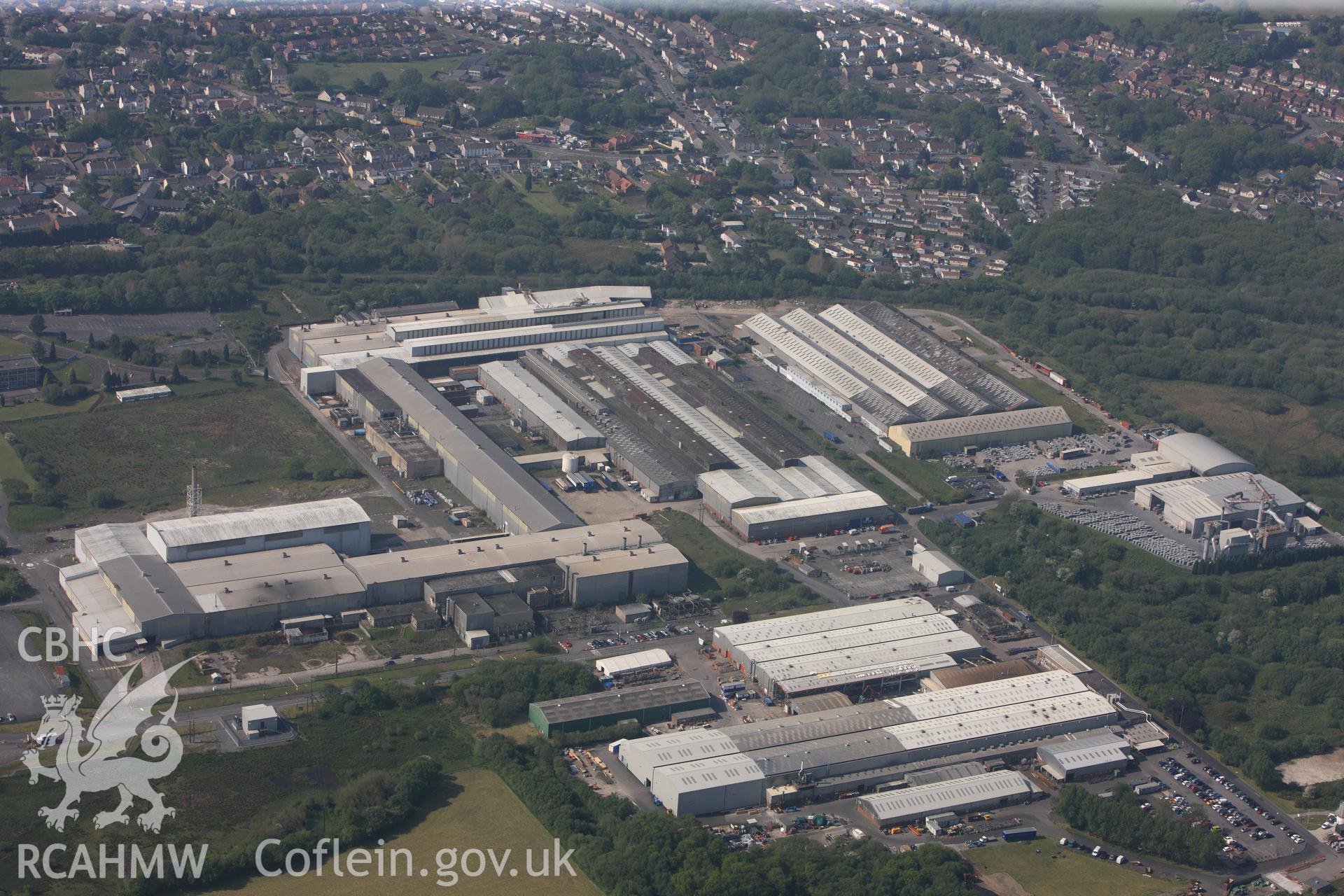 RCAHMW colour oblique photograph of General view of Alcoa factory, looking south west. Taken by Toby Driver on 24/05/2012.