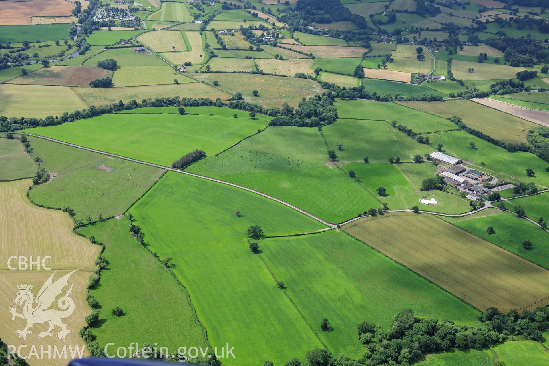 RCAHMW colour oblique photograph of Forden Gaer, landscape view of complex from the east. Taken by Toby Driver on 27/07/2012.
