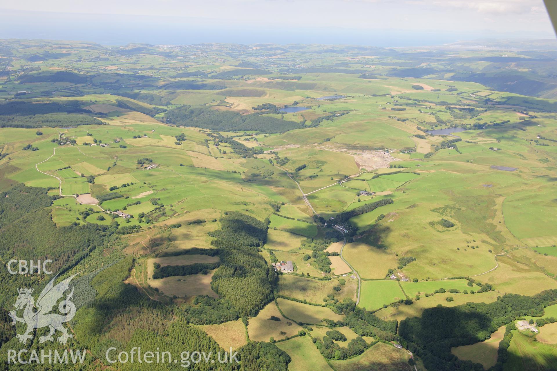 RCAHMW colour oblique photograph of Coed Maenarthur with Maen Arthur Chapel in centre foreground, looking west. Taken by Toby Driver on 10/08/2012.