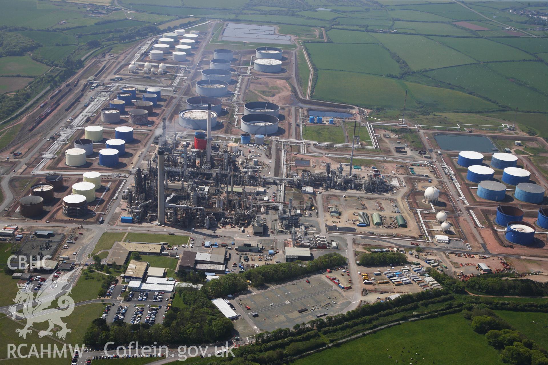 RCAHMW colour oblique photograph of General view of Amoco oil refinery, looking south. Taken by Toby Driver on 24/05/2012.